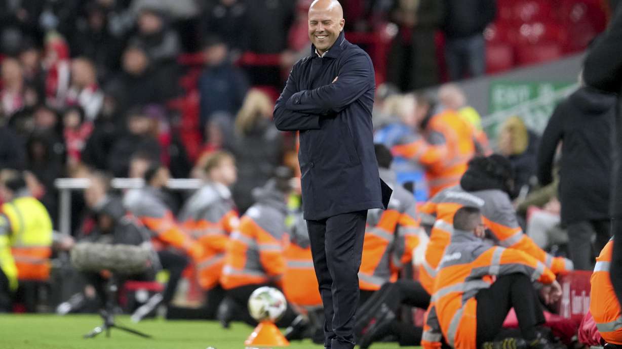 Liverpool's manager Arne Slot smiles after Cody Gakpo scored their fourth goal during the English League Cup soccer match between Liverpool and West Ham United at Anfield Stadium, Liverpool, England, Wednesday, Sept. 25, 2024.