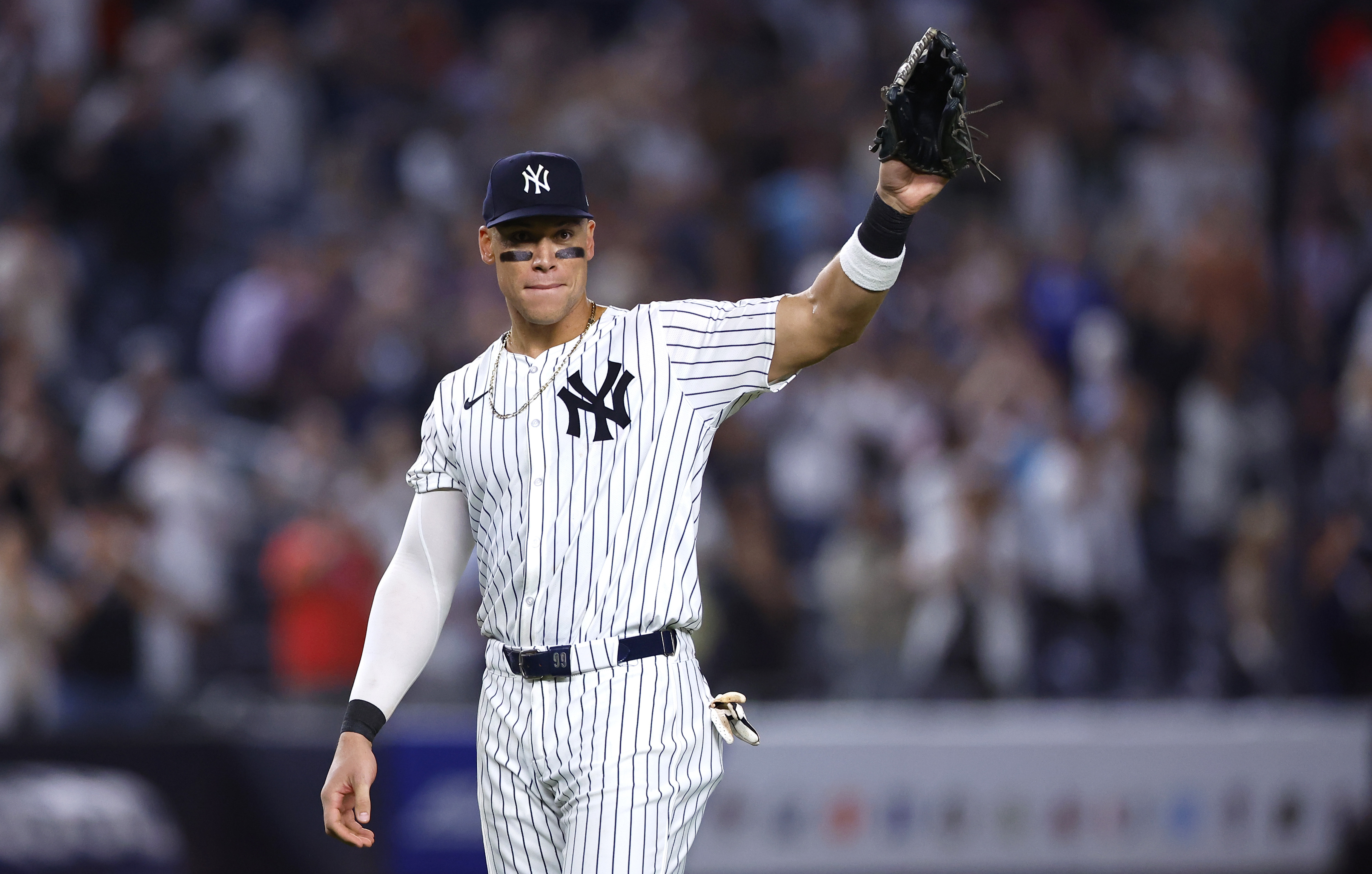 Aaron Judge waves to fans after the New York Yankees clinched the American League East title, Thursday, Sept. 26, 2024, in New York.