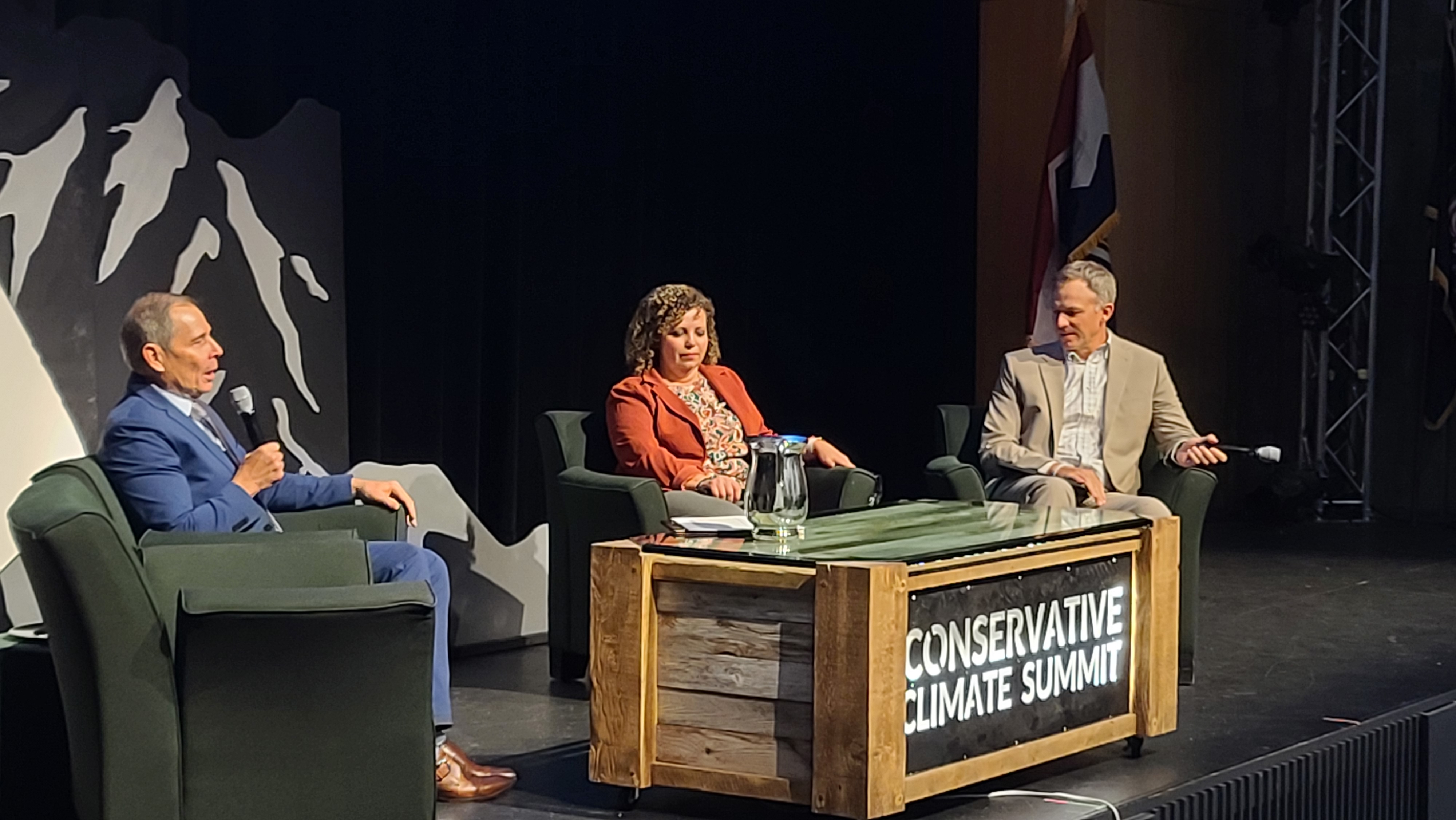 Utah Reps. John Curtis, left, Celeste Maloy and Blake Moore speak at Utah Valley University's Ragan Theater in Orem during a panel as part of the Conservative Climate Summit on Friday.