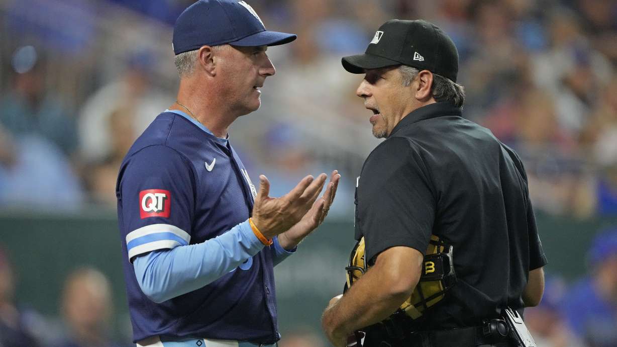 Kansas City Royals manager Matt Quatraro talks to home plate umpire James Hoye during the sixth inning of a baseball game against the San Francisco Giants Friday, Sept. 20, 2024, in Kansas City, Mo.