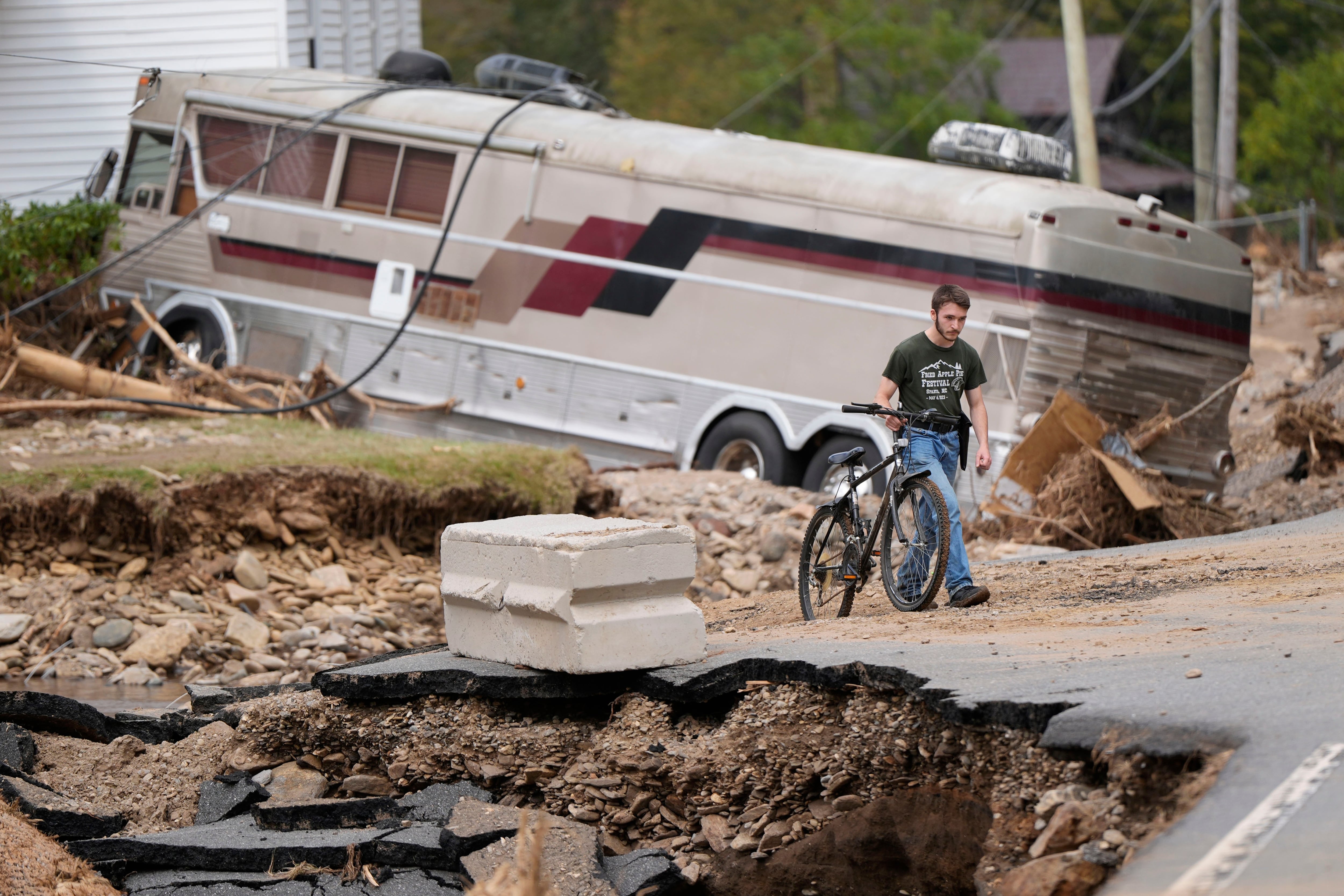 Dominick Gucciardo walks to his home in the aftermath of Hurricane Helene, Thursday in Pensacola, N.C. October could still hold election surprises ahead.