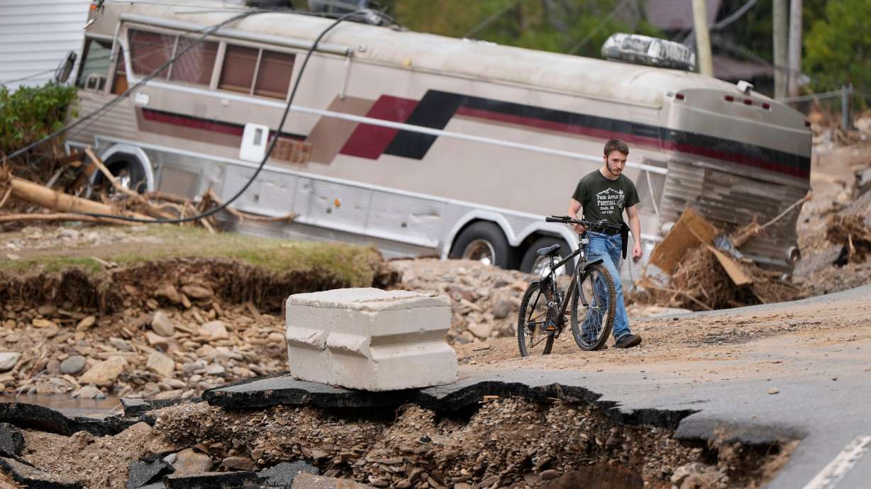 Dominick Gucciardo walks to his home in the aftermath of Hurricane Helene, Thursday in Pensacola, N.C. October could still hold election surprises ahead.