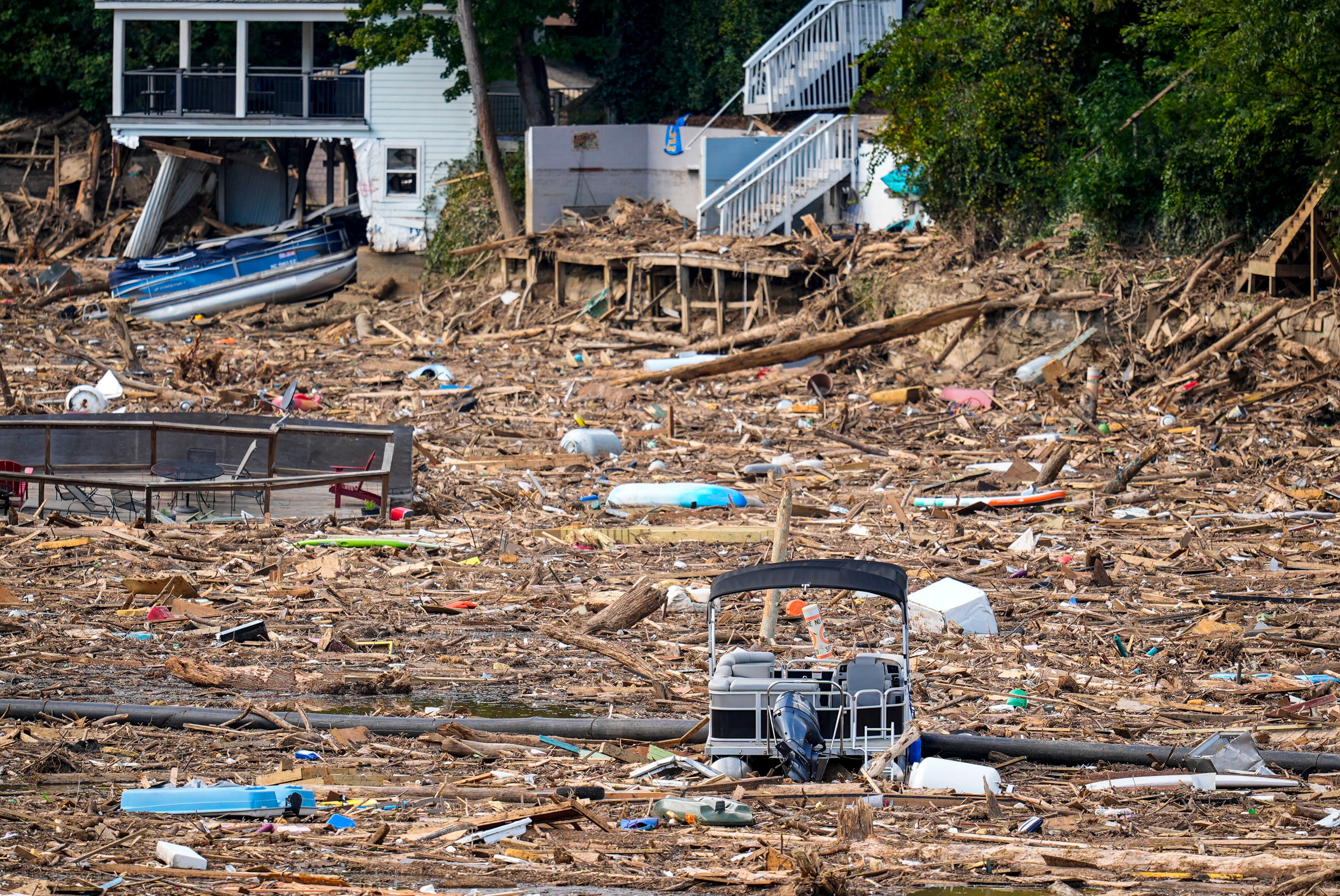 Debris is strewn on the lake in the aftermath of Hurricane Helene, Wednesday in Lake Lure, N.C.