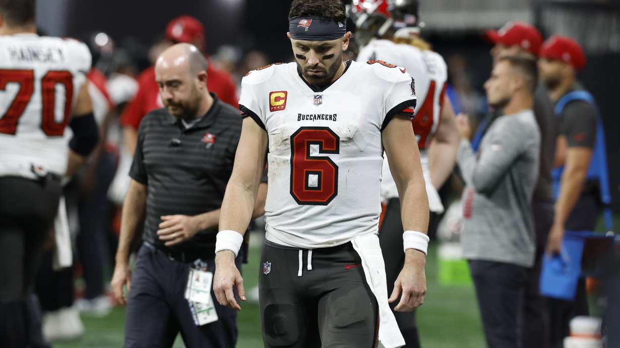 Tampa Bay Buccaneers quarterback Baker Mayfield walks off after the team lost to the Atlanta Falcons during overtime in an NFL football game Thursday, Oct. 3, 2024, in Atlanta.