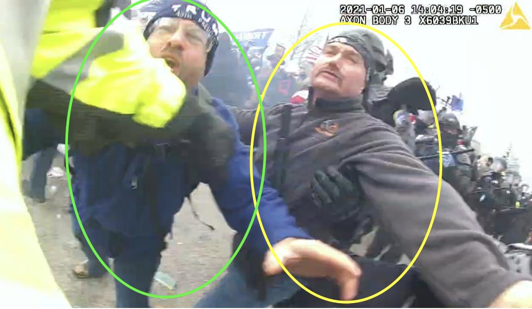 Prosecutors say this picture, captured from body camera footage on Jan. 6, 2021, shows Utahn Christopher Jordan lunging toward a police officer as his brother Earl Jordan stands next to him.