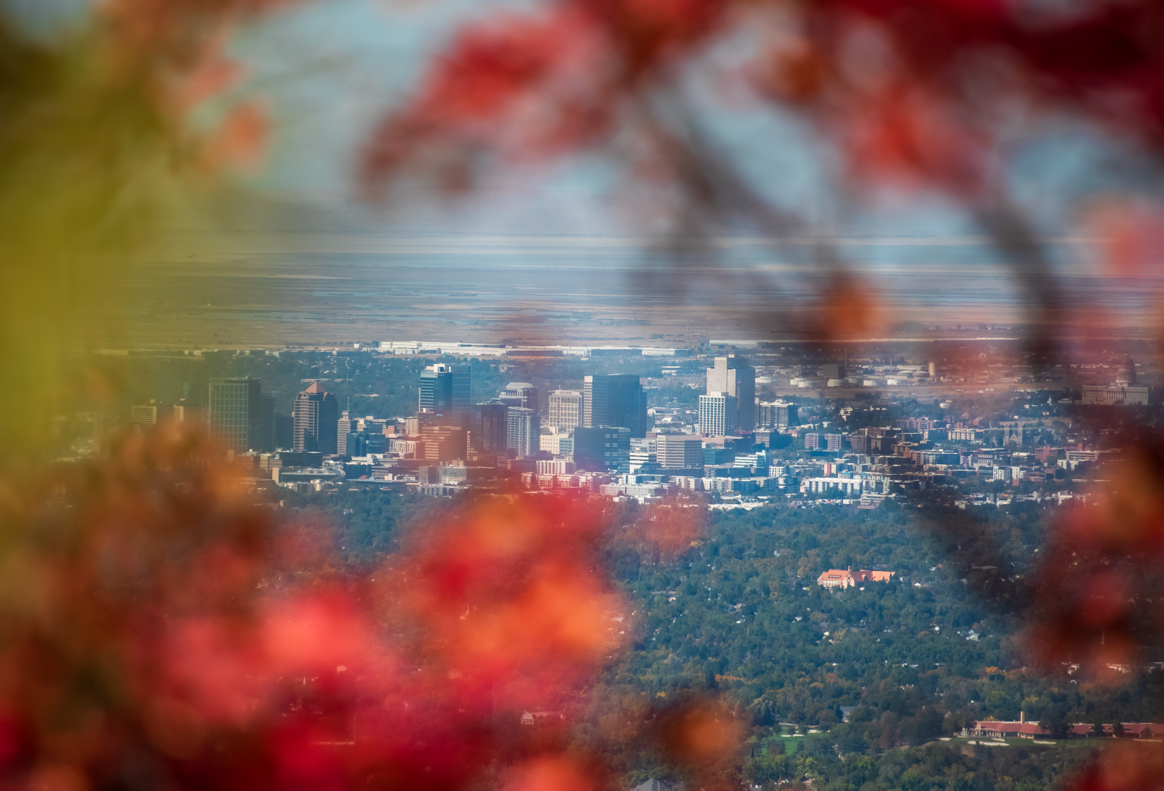 The Salt Lake City skyline is visible through the fall colors at Neffs Canyon on Sept. 28. The city surpassed 90 degrees on Friday, the first time that has happened in October since temperature data collection began in 1874. 