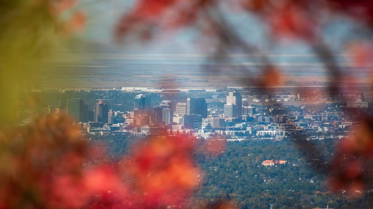 The Salt Lake City skyline is visible through the fall colors at Neffs Canyon on Sept. 28. The city surpassed 90 degrees on Friday, the first time that has happened in October since temperature data collection began in 1874.