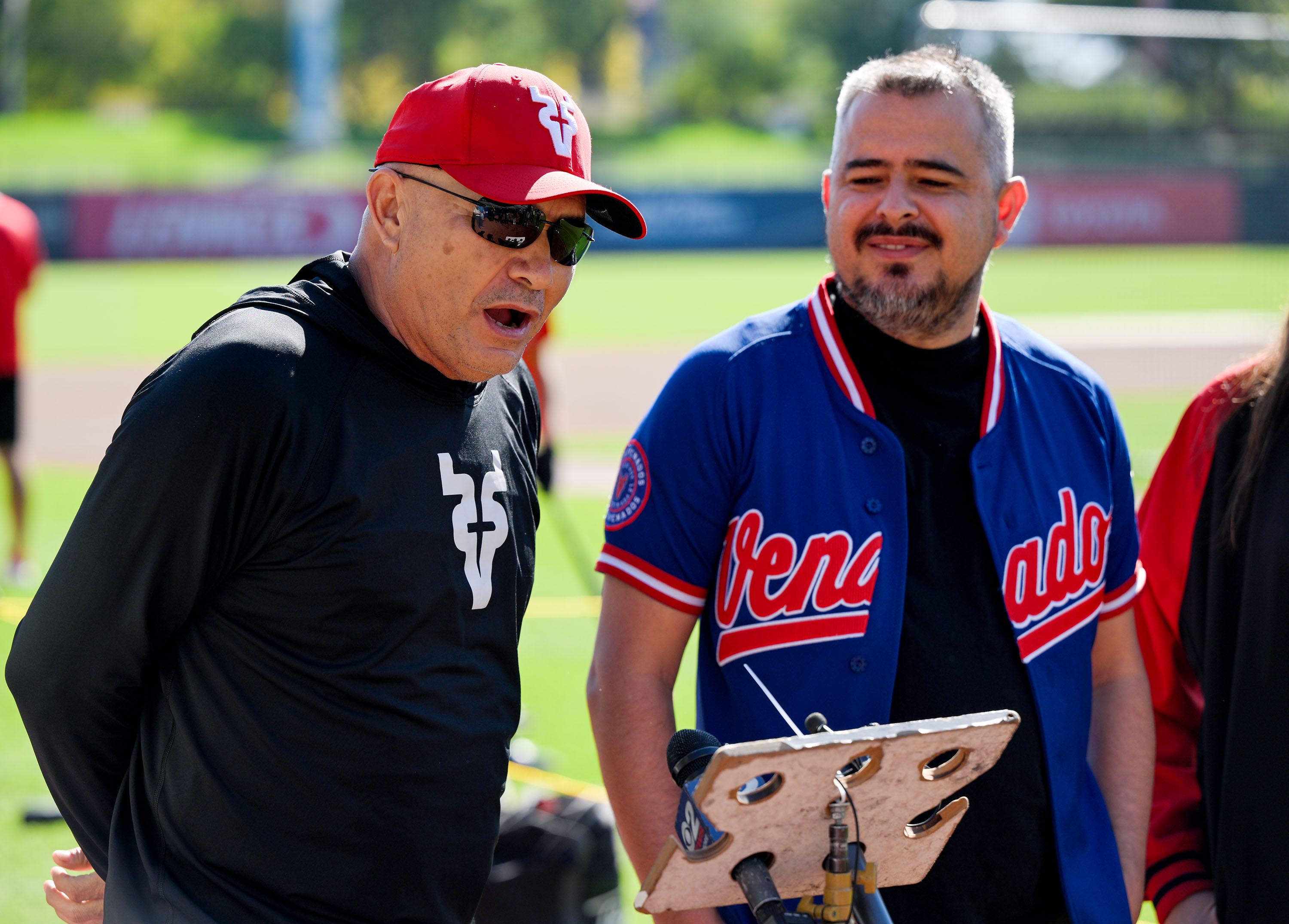 Jose Pacho, left, manager of the Venados de Mazatlán baseball team, speaks at a press conference on Friday at Smith's Ballpark to promote "Beisbol en Salt Lake" weekend, featuring games between two Mexican teams.