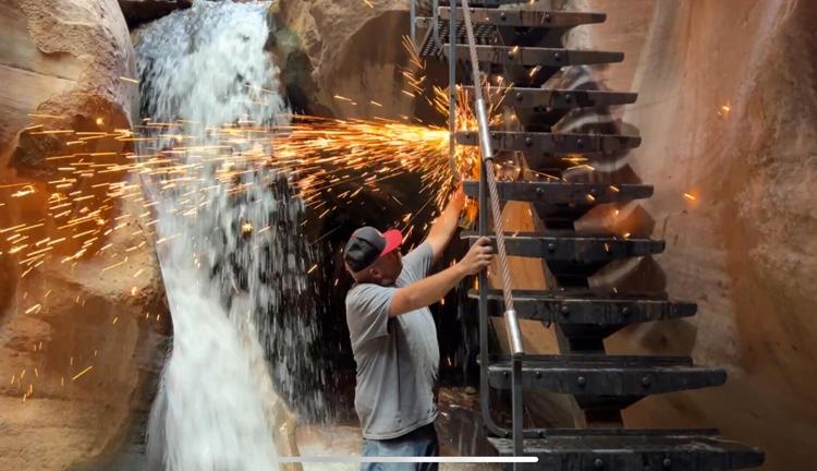 Welder Andy Funderburke works on the new Kanarra Falls stairs near Kanarraville, Utah, in this undated photo.