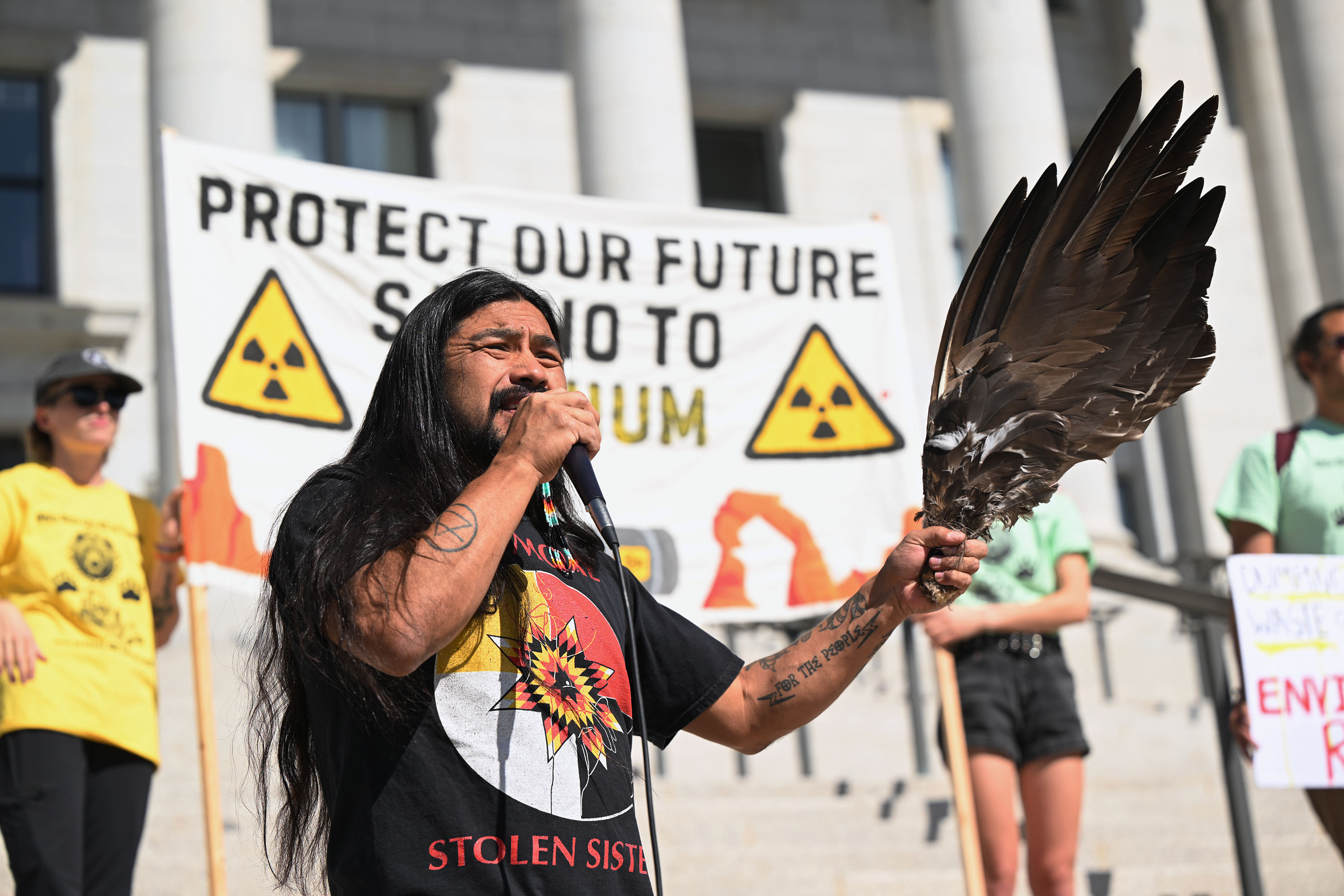 Activist Carl Moore talks before performing a blessing as members of the White Mesa Ute community rally at the Capitol in Salt Lake City to protect their health, environment and cultural heritage from Energy Fuels Resources’ White Mesa uranium mill on Friday.