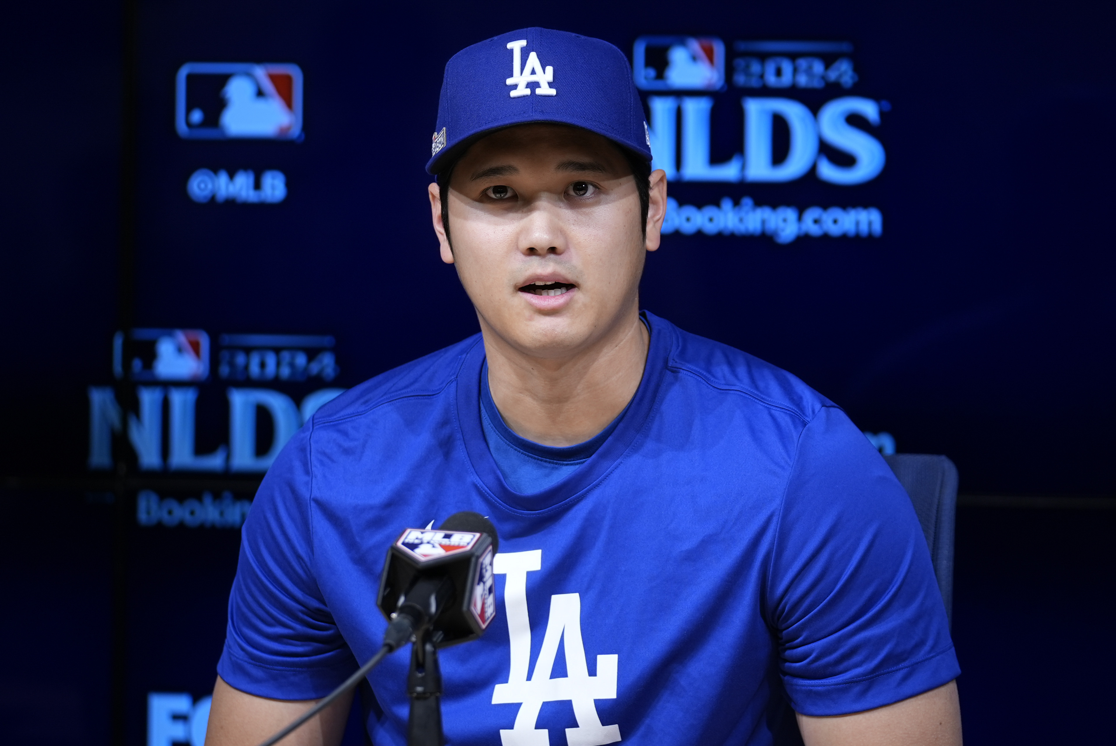 Los Angeles Dodgers' Shohei Ohtani speaks to reporters in a press conference in preparation for Game 1 of a baseball NL Division Series against the San Diego Padres in Los Angeles, Friday, Oct. 4, 2024.