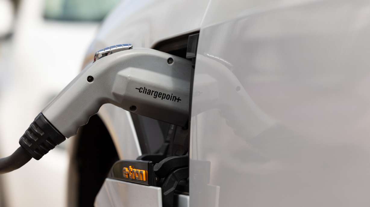 A car is plugged into an electric charging station outside of the Utah State Capitol in Salt Lake City on May 2. Utah transportation officials say they are ready to take the next step to expand charging stations across rural routes.