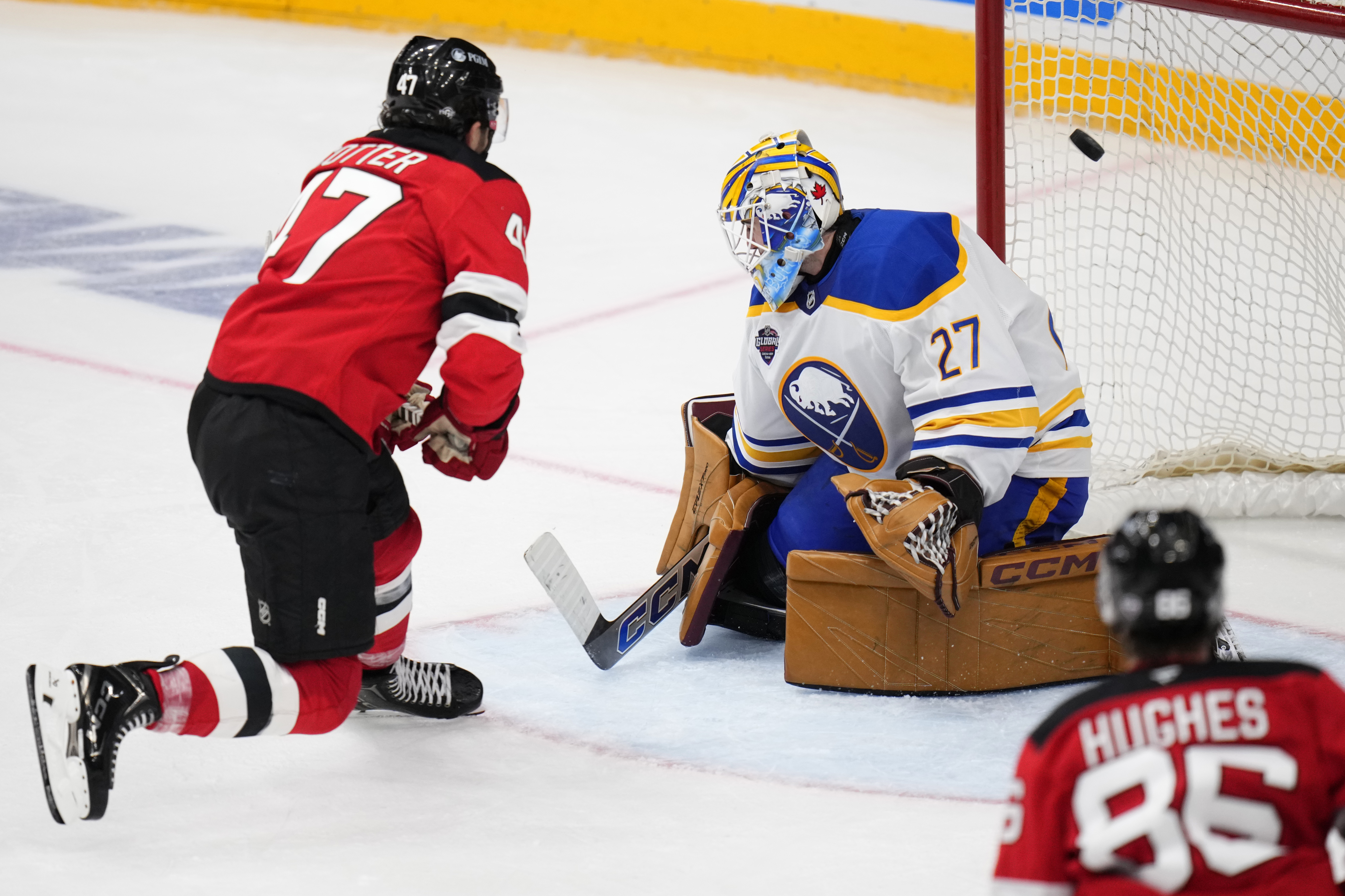 New Jersey Devils' Paul Cotter scores his sides second goal past Buffalo Sabres' Devon Levi during the NHL hockey game between Buffalo Sabres and New Jersey Devils, in Prague, Czech Republic, Saturday, Oct. 5, 2024.