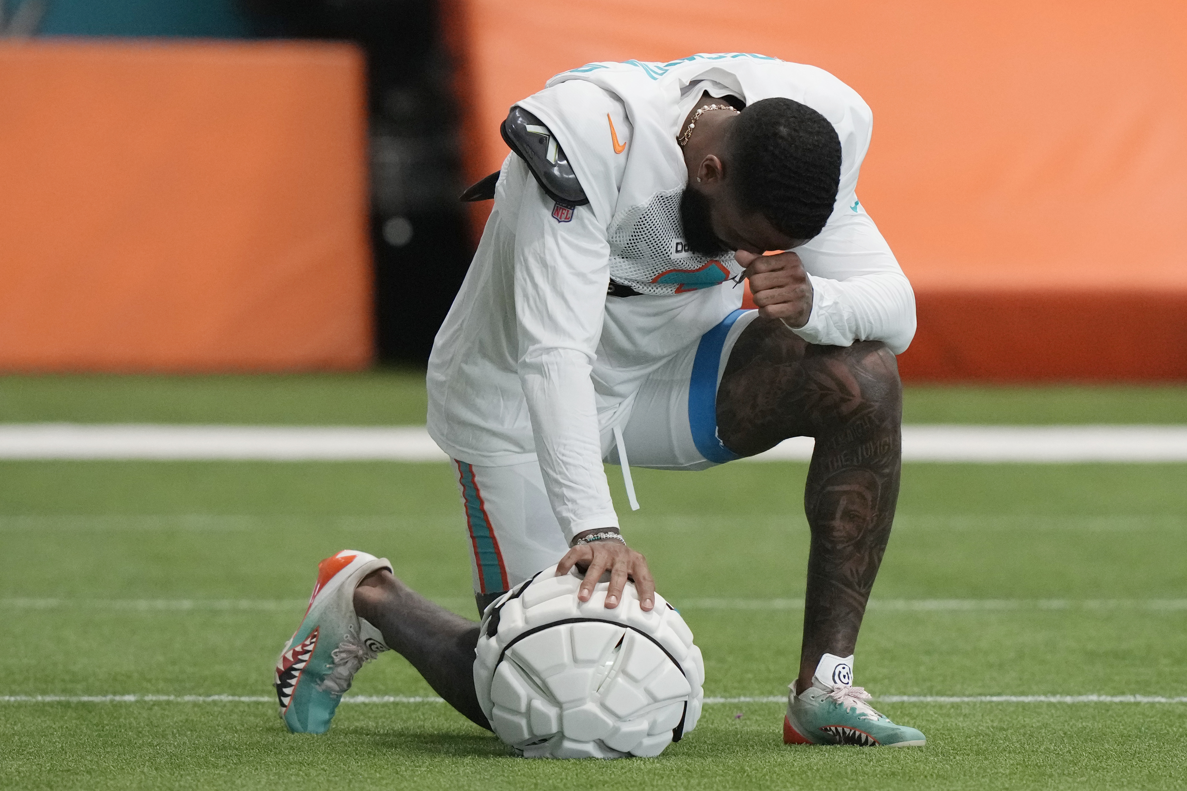 Miami Dolphins wide receiver Odell Beckham Jr. takes a moment during practice at the NFL football team's training facility, Thursday, Oct. 3, 2024, in Miami Gardens, Fla.