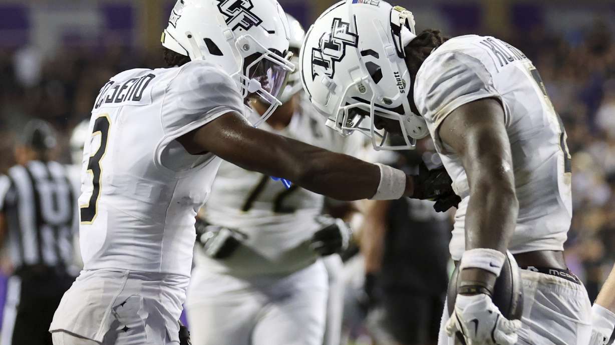 Central Florida wide receiver Xavier Townsend (3) celebrates the game-tying touchdown by wide receiver Kobe Hudson (2) in the fourth quarter against TCU during an NCAA college football game Saturday, Sept. 14, 2024, in Fort Worth, Texas.