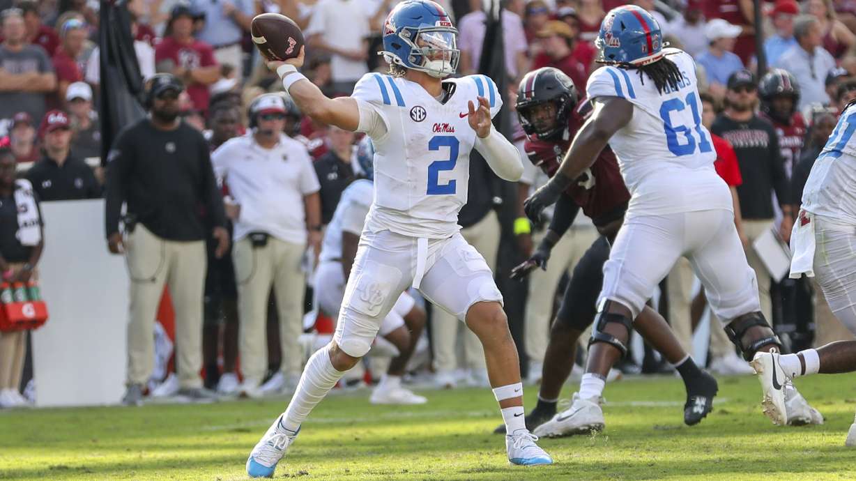 Mississippi quarterback Jaxson Dart (2) throws a pass for a first down during the first half of an NCAA college football game against South Carolina Saturday, Oct. 5, 2024, in Columbia, S.C.