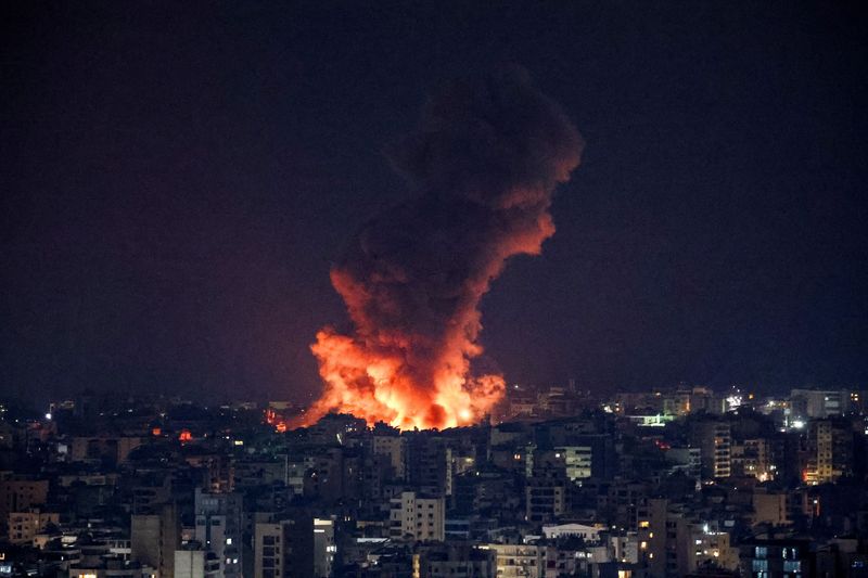 Smoke and flames rise over Beirut's southern suburbs after a strike, amid ongoing hostilities between Hezbollah and Israeli forces, as seen from Sin El Fil, Lebanon, Sunday.