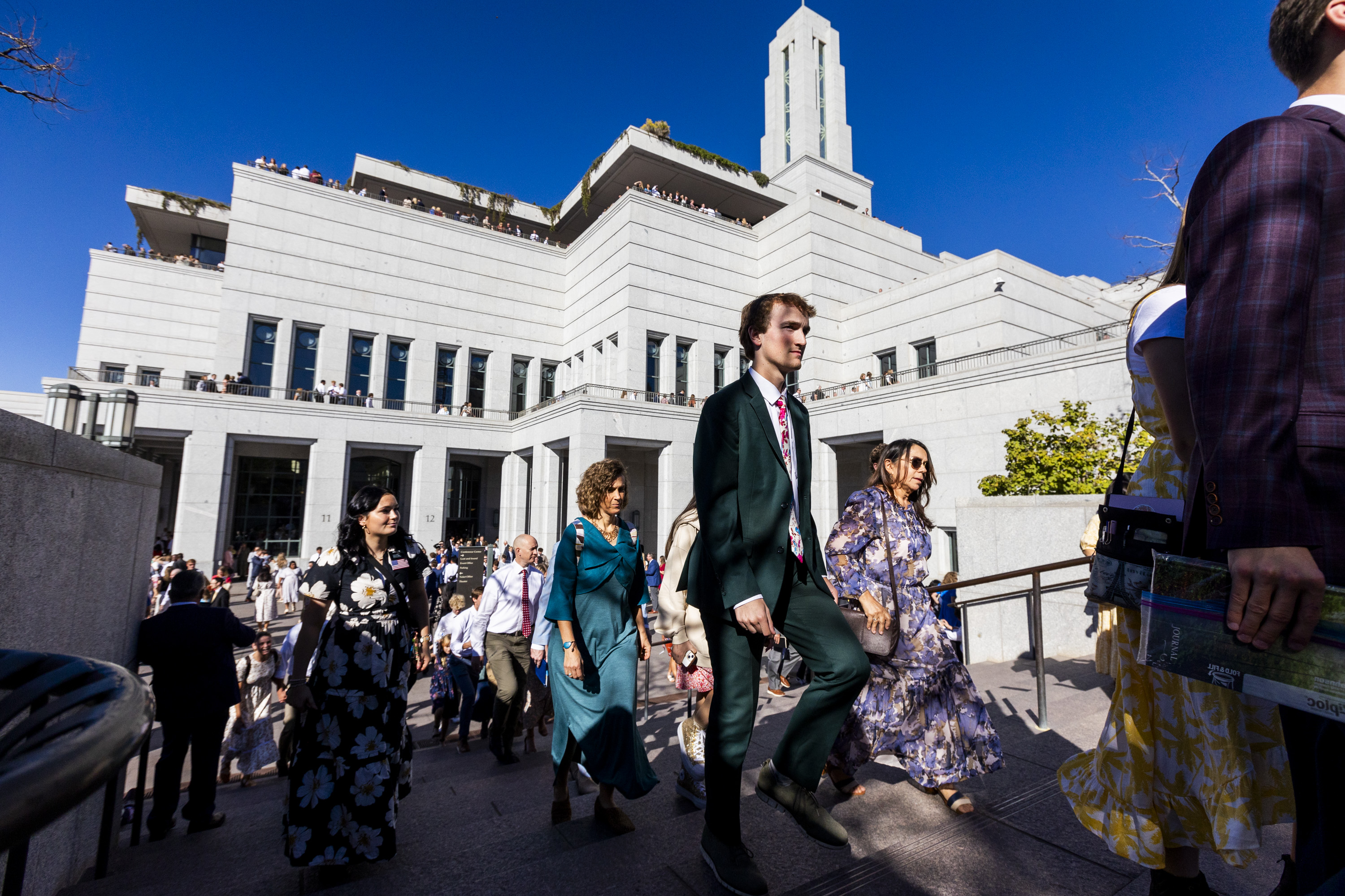 Conferencegoers exit the Conference Center after the afternoon session of the 194th Semiannual General Conference of The Church of Jesus Christ of Latter-day Saints held at the Conference Center in Salt Lake City on Saturday.