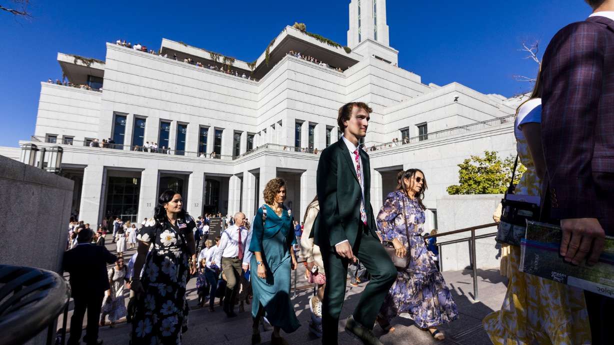 Conferencegoers exit the Conference Center after the afternoon session of the 194th Semiannual General Conference of The Church of Jesus Christ of Latter-day Saints held at the Conference Center in Salt Lake City on Saturday.