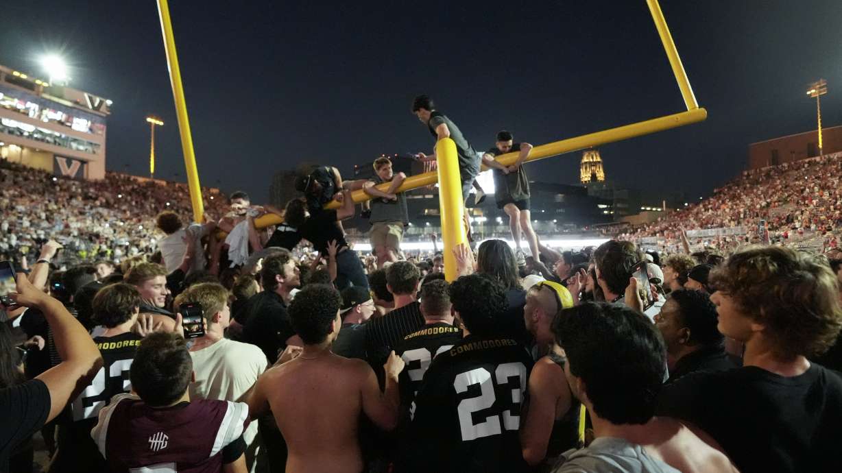 Vanderbilt fans tear down the goal post the after team's 40-35 win over No. 1 Alabama in an NCAA college football game Saturday, Oct. 5, 2024, in Nashville, Tenn.