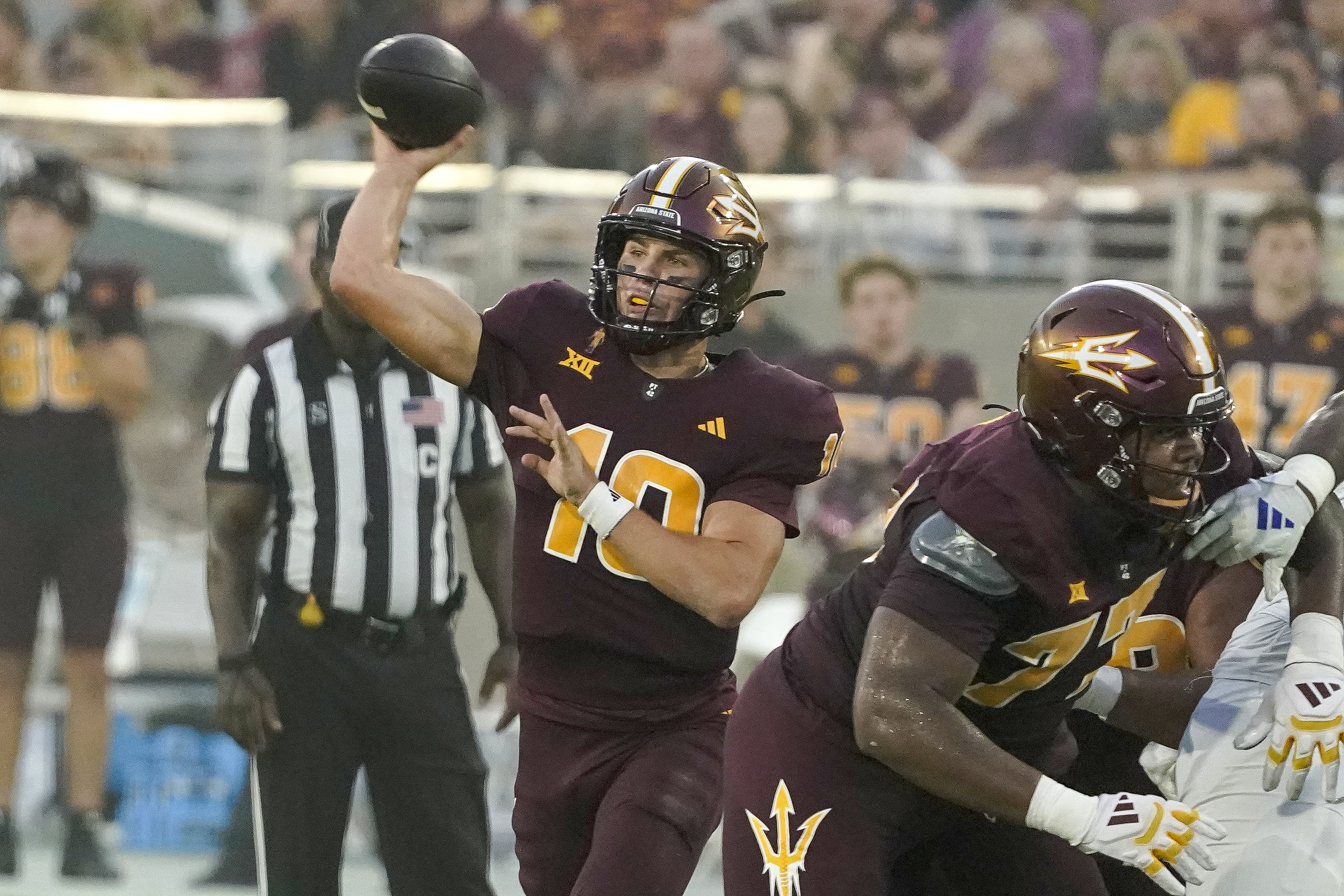 Arizona State quarterback Sam Leavitt (10) throws against Kansas during the first half of an NCAA college football game Saturday, Oct. 5, 2024, in Tempe, Ariz.