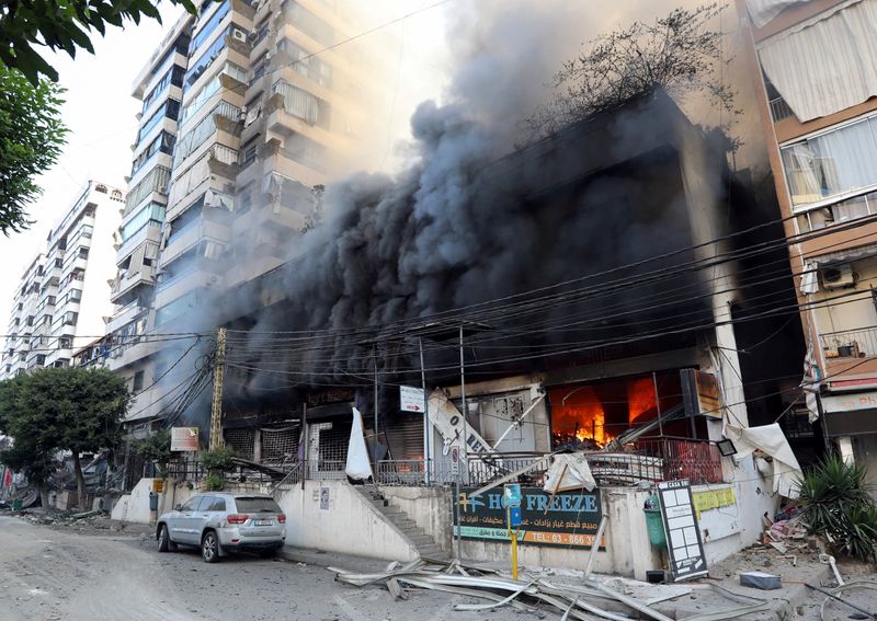 Smoke rises from shops, in the aftermath of Israeli strikes on Beirut's southern suburbs, amid the ongoing hostilities between Hezbollah and Israeli forces, Lebanon, Sunday.