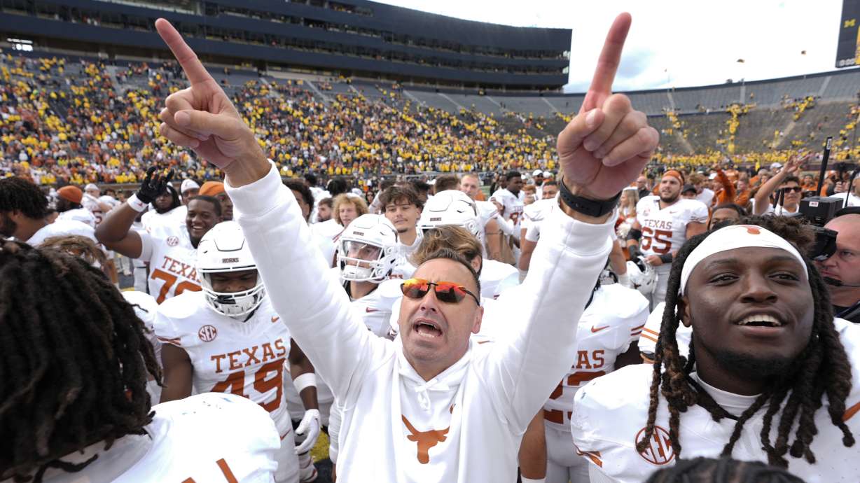 Texas head coach Steve Sarkisian celebrates after in beating Michigan 31-12 in an NCAA college football game in Ann Arbor, Mich., Saturday, Sept. 7, 2024.