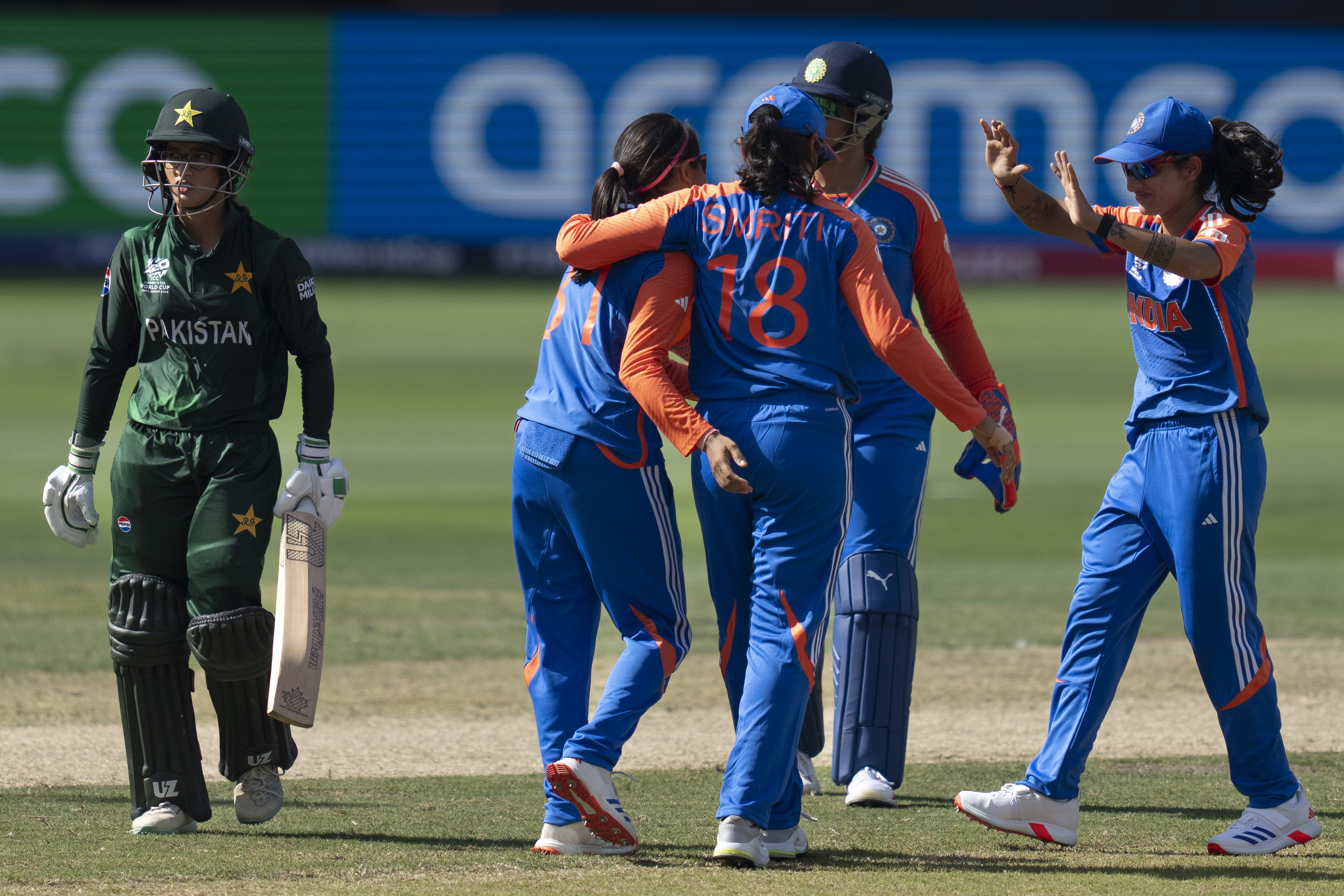 Indian players celebrate the wicket of Pakistan's Aliya Riaz, left, during the ICC Women's T20 World Cup 2024 match between Pakistan and India at Dubai International Stadium, United Arab Emirates, Sunday, Oct. 6, 2024.