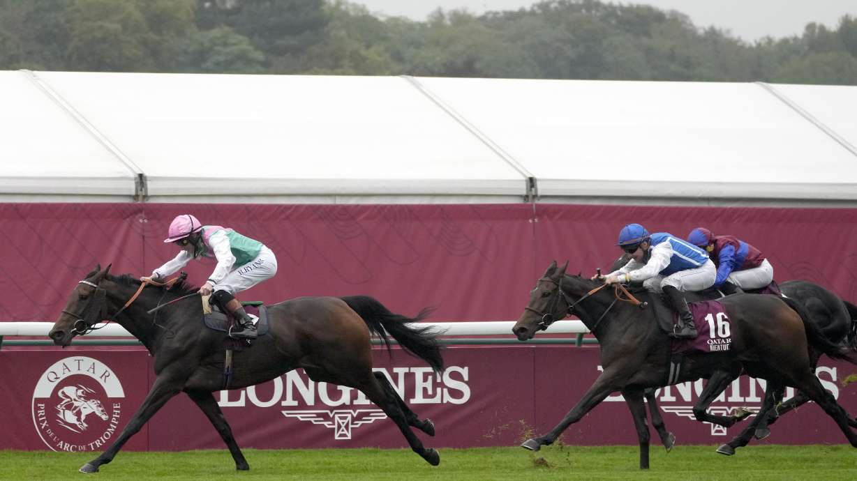 Bluestocking, ridden by Rossa Ryan, races ahead of Aventure, ridden by Stephane Pasquier, to win the Prix de l'Arc de Triomphe horse race at the Longchamp race track, outside Paris, Sunday, Oct. 6, 2024.