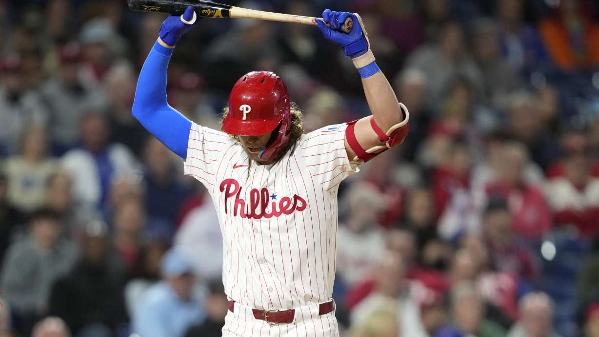 Philadelphia Phillies' Alec Bohm reacts after striking out against Chicago Cubs pitcher Hayden Wesneski during the eighth inning of a baseball game, Tuesday, Sept. 24, 2024, in Philadelphia.