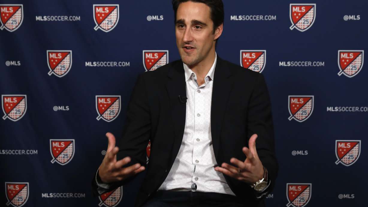 FILE - Austin FC head coach Josh Wolf gestures during an interview in New York, Feb. 26, 2020.