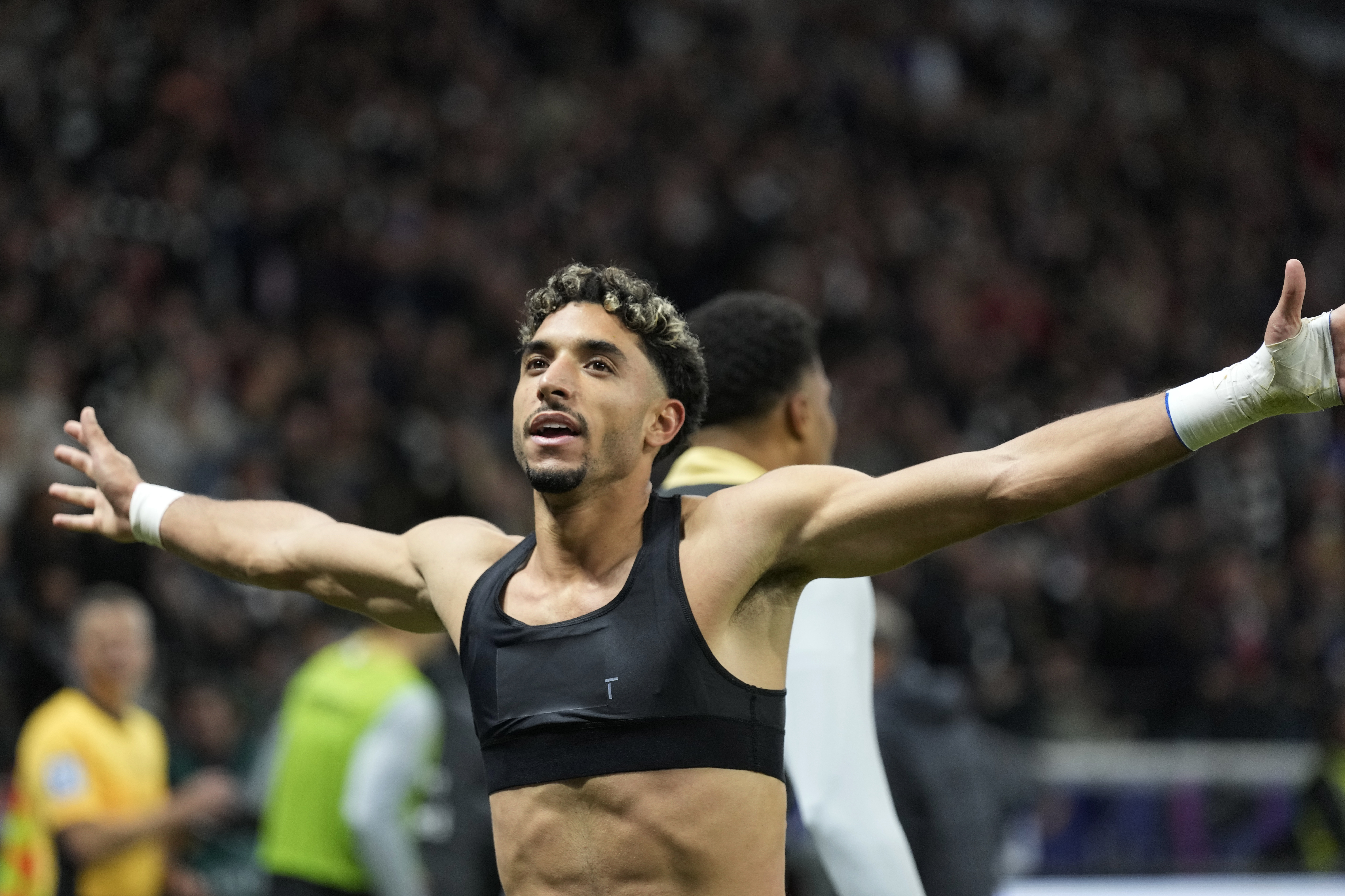 Frankfurt's Omar Marmoush celebrates after scoring his side's third goal during the German Bundesliga soccer match between Eintracht Frankfurt and Bayern Munich in Frankfurt, Germany, Sunday, Oct. 6, 2024.