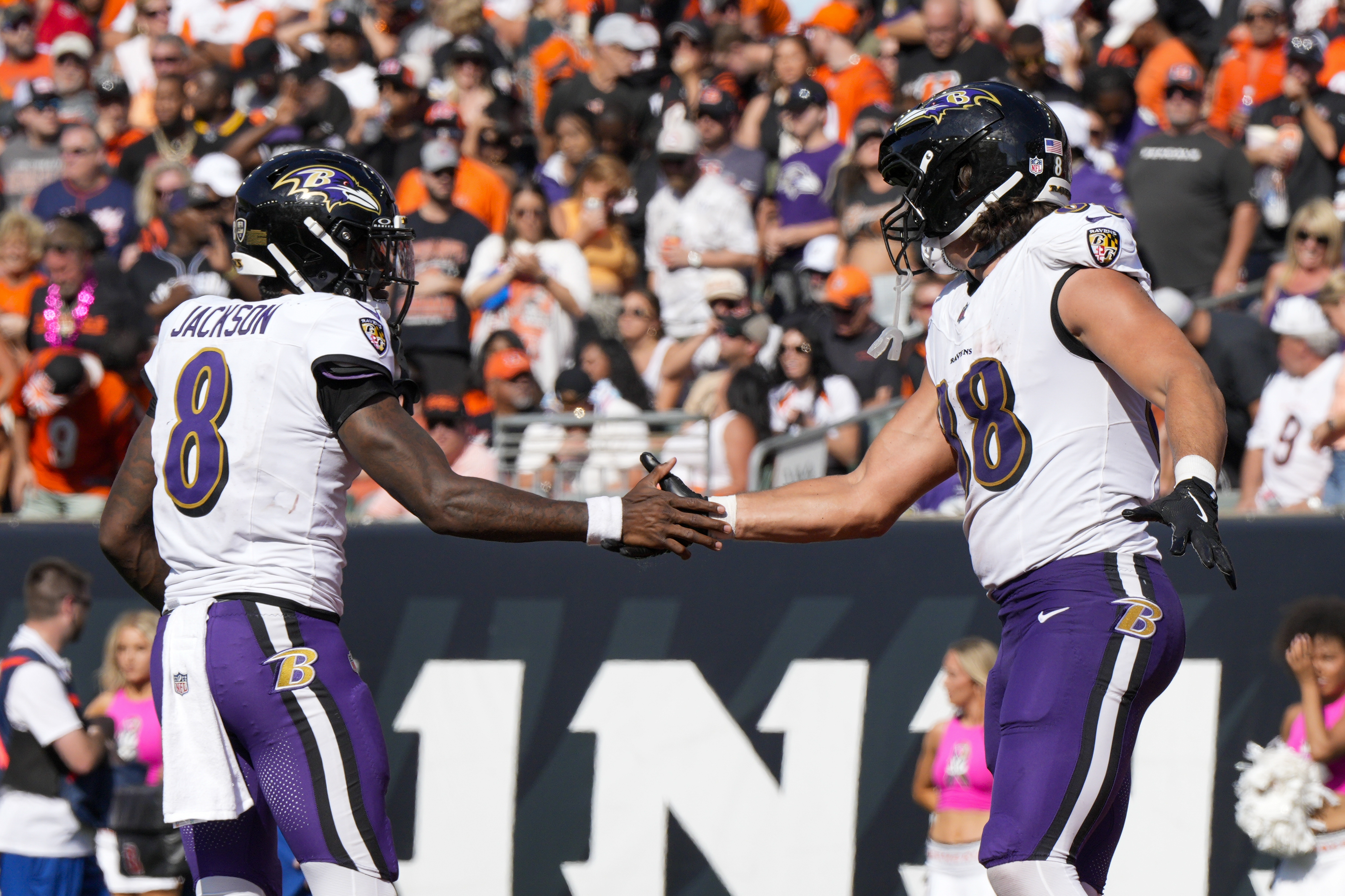 Baltimore Ravens quarterback Lamar Jackson (8) and tight end Charlie Kolar (88) react after they connected for a touchdown pass and catch against the Cincinnati Bengals during the second half of an NFL football game, Sunday, Oct. 6, 2024, in Cincinnati.