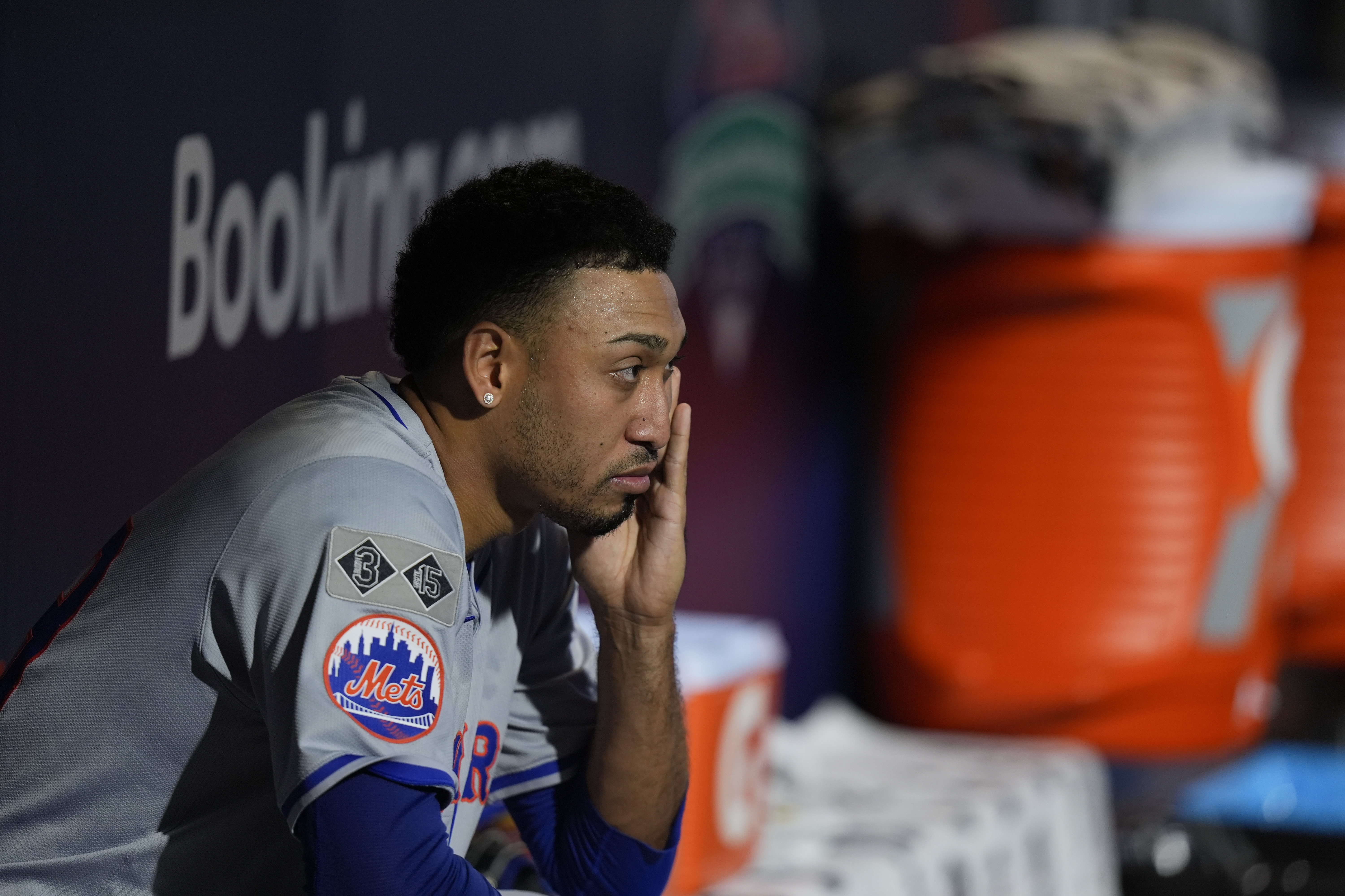 New York Mets pitcher Edwin Díaz looks out of the dugout after being pulled during the eight inning of Game 2 of a baseball NL Division Series against the Philadelphia Phillies, Sunday, Oct. 6, 2024, in Philadelphia.