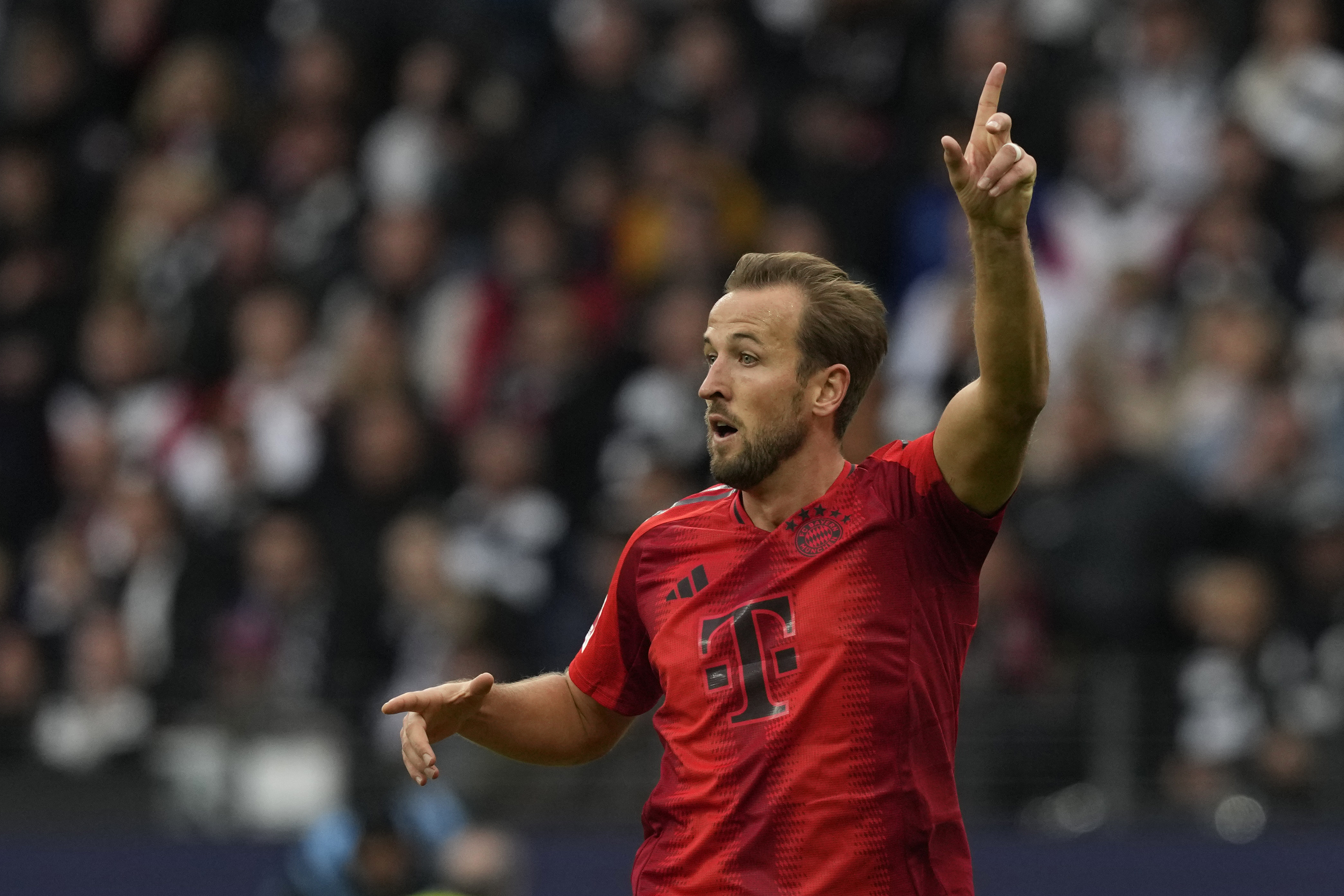 Bayern's Harry Kane gestures during the German Bundesliga soccer match between Eintracht Frankfurt and Bayern Munich in Frankfurt, Germany, Sunday, Oct. 6, 2024.