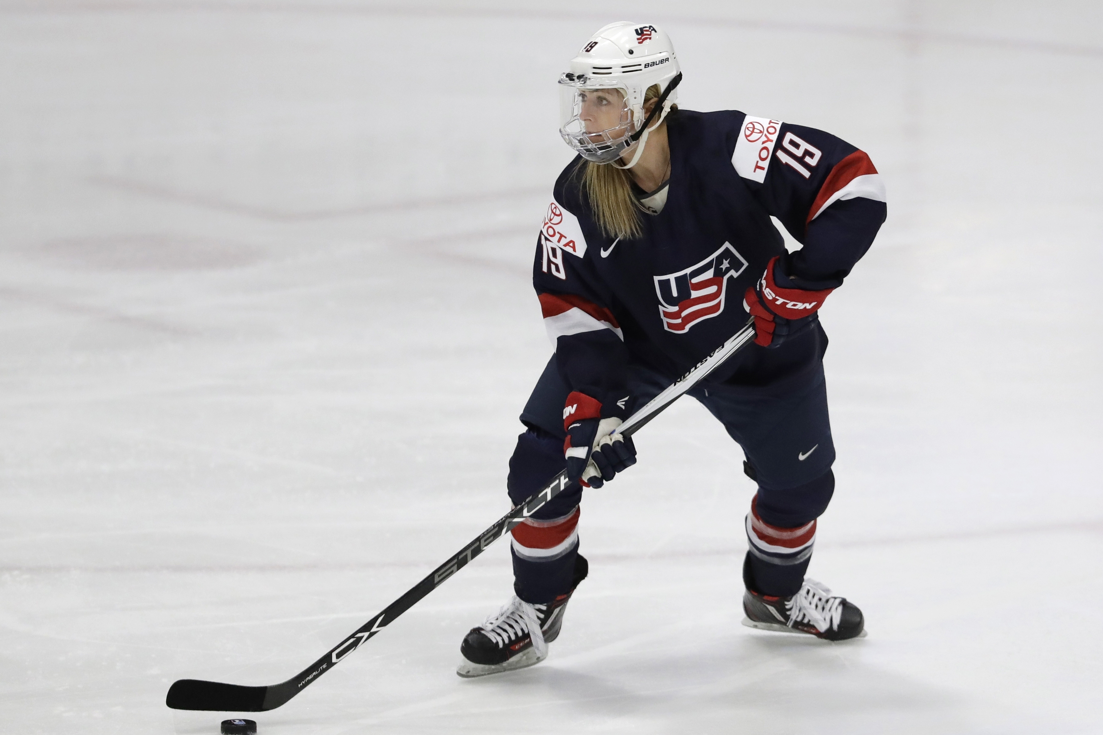 FILE - United States forward Gigi Marvin controls the puck during the first period of a IIHF Women's World Championship semifinal hockey tournament game against Germany, Thursday, April 6, 2017, in Plymouth, Mich.