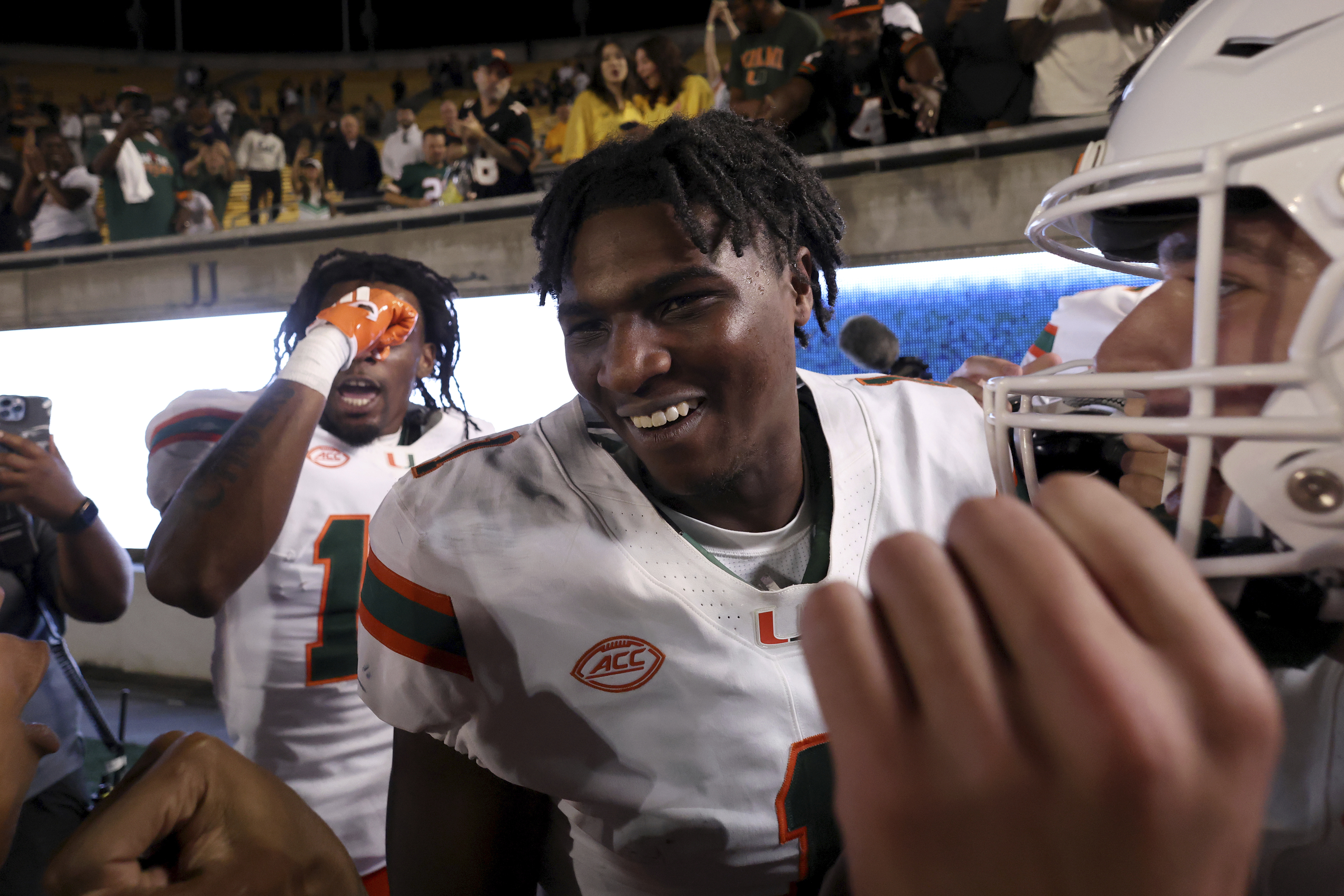 Miami quarterback Cam Ward (1) celebrates after defeating California during an NCAA college football game in Berkeley, Calif., Saturday, Oct. 5, 2024.