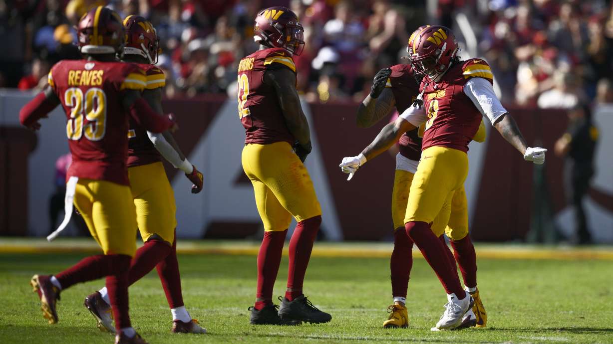 Washington Commanders linebacker Dante Fowler Jr., right, celebrates his sack of Cleveland Browns quarterback Deshaun Watson (not shown) during the second half of an NFL football game in Landover, Md., Sunday, Oct. 6, 2024.