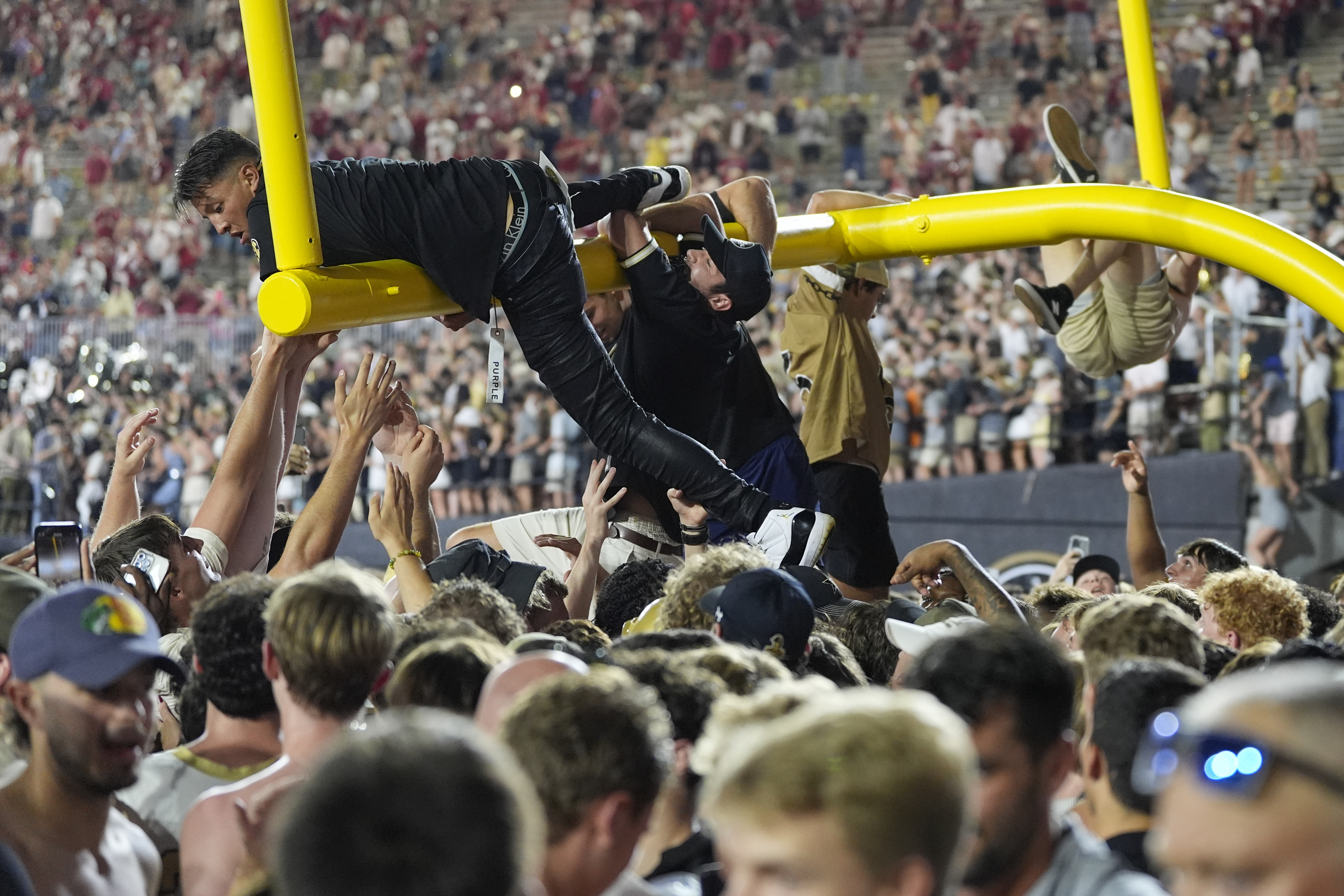 Vanderbilt fans tear down the goal post after the team's 40-35 win against Alabama after an NCAA college football game Saturday, Oct. 5, 2024, in Nashville, Tenn.