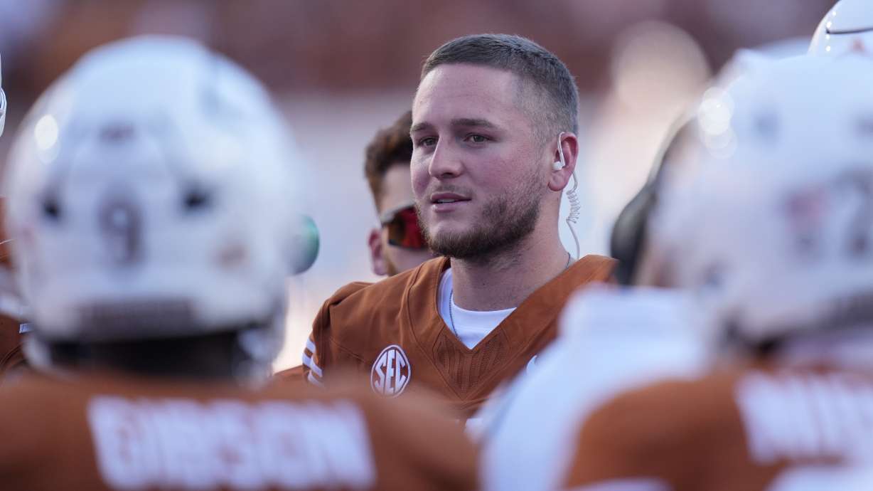 Texas quarterback Quinn Ewers stands on the side lines during the second half of an NCAA college football game against Mississippi State in Austin, Texas, Saturday, Sept. 28, 2024.