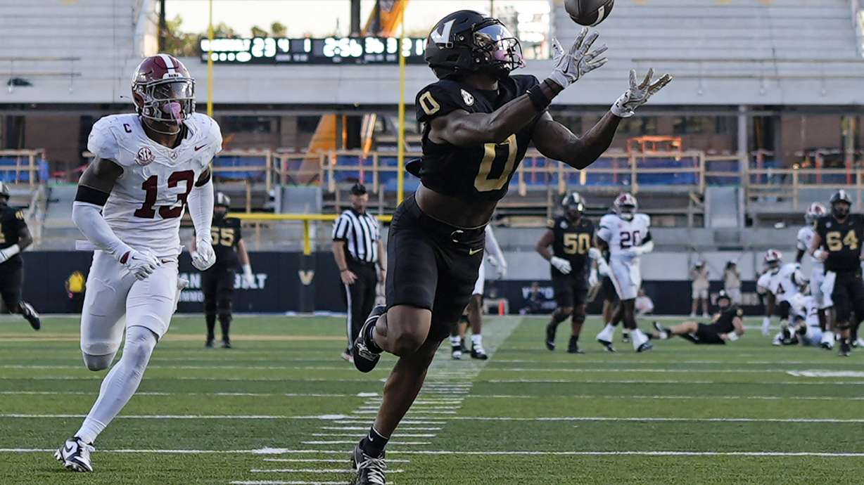 Vanderbilt wide receiver Junior Sherrill (0) makes a catch for a touchdown ahead of Alabama defensive back Malachi Moore (13) during the second half of an NCAA college football game Saturday, Oct. 5, 2024, in Nashville, Tenn.