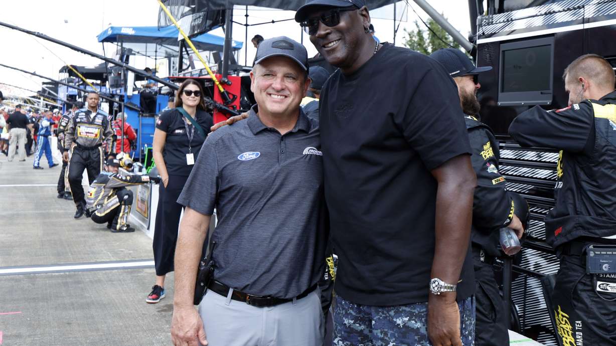 Bob Jenkins, owner of Front Row Motorsports and Co-Owner Michael Jordan, of 23XI Racing, pose before a NASCAR Cup Series auto race at Talladega Superspeedway, Sunday, Oct. 6, 2024, in Talladega, Ala.