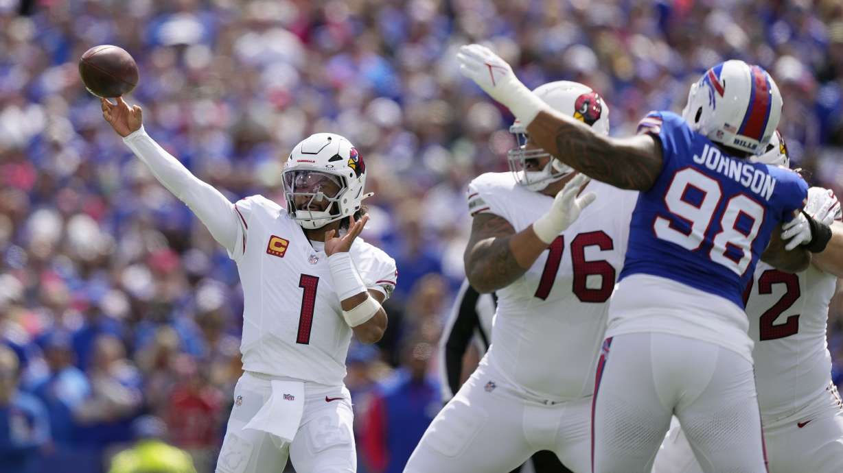 Arizona Cardinals quarterback Kyler Murray (1) throws the ball as Cardinals guard Will Hernandez (76) blocks Buffalo Bills defensive tackle Austin Johnson (98) during the first half of an NFL football game Sunday, Sept. 8, 2024, in Orchard Park, N.Y.