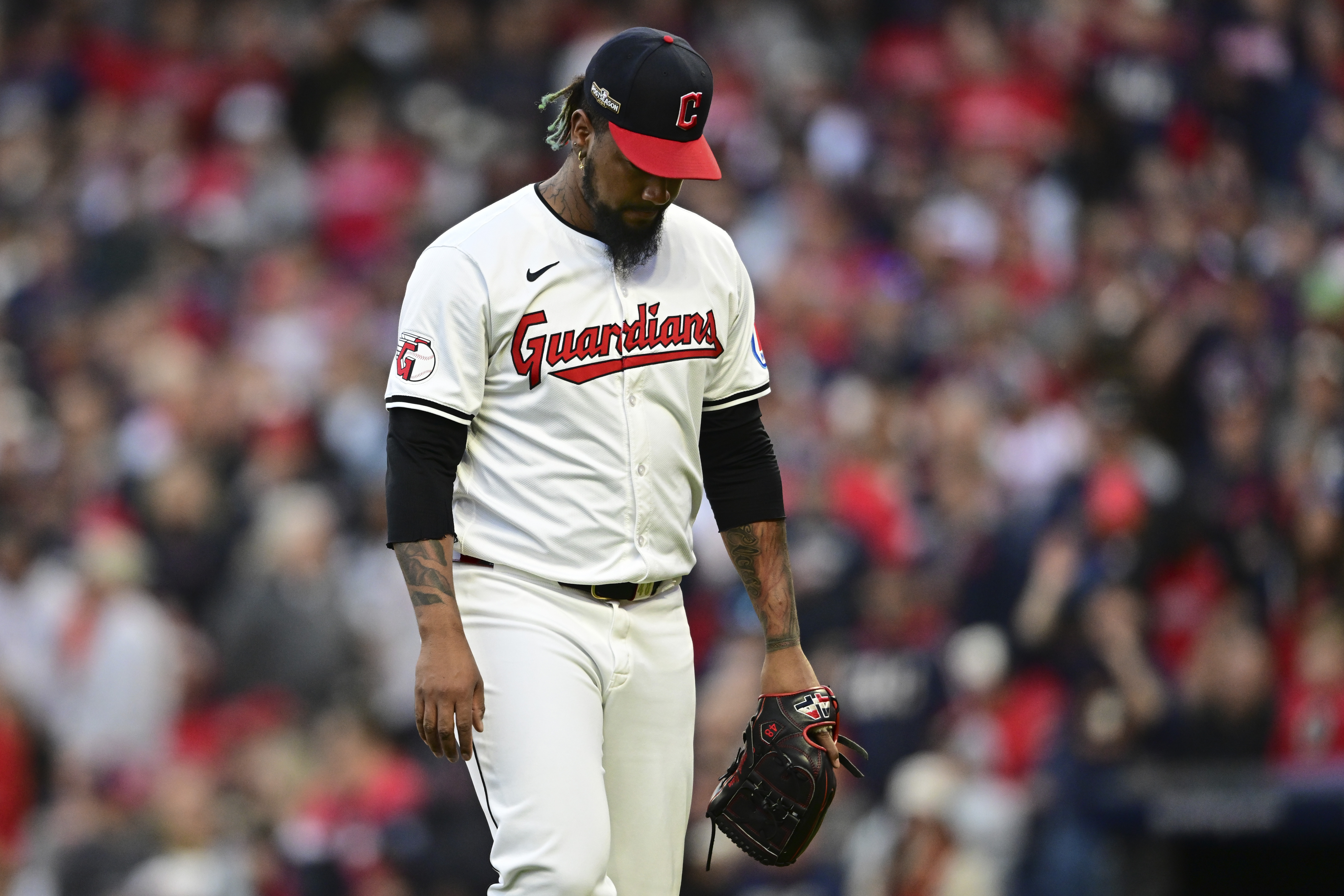 Cleveland Guardians pitcher Emmanuel Clase walks off the field after being taken out of the game in the ninth inning during Game 2 of baseball's AL Division Series against the Detroit Tigers, Monday, Oct. 7, 2024, in Cleveland.