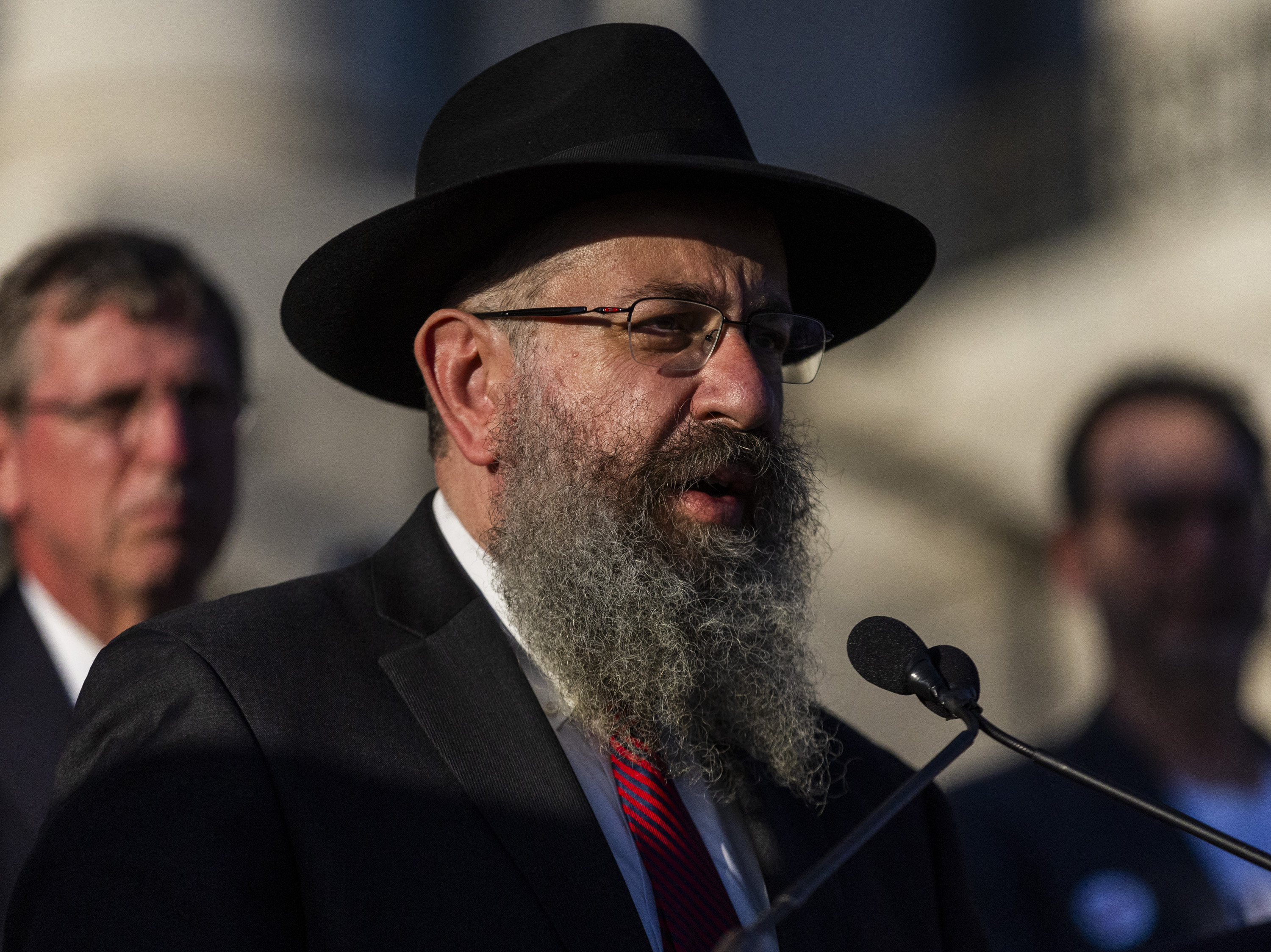 Rabbi Benny Zippel, from the Chabad of Utah, speaks during a memorial by the United Jewish Federation of Utah, alongside the Jewish and non-Jewish communities, to commemorate the one-year anniversary of the Oct. 7 attack on Israel by Hamas last year, at the state Capitol in Salt Lake City on Monday.