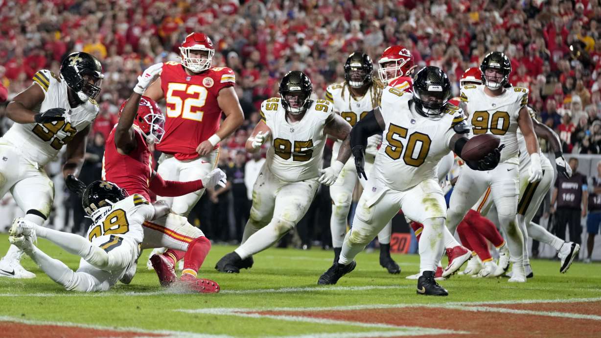 New Orleans Saints defensive tackle Khalen Saunders (50) intercepts a pass in the end zone during the second half of an NFL football game against the Kansas City Chiefs Monday, Oct. 7, 2024, in Kansas City, Mo.