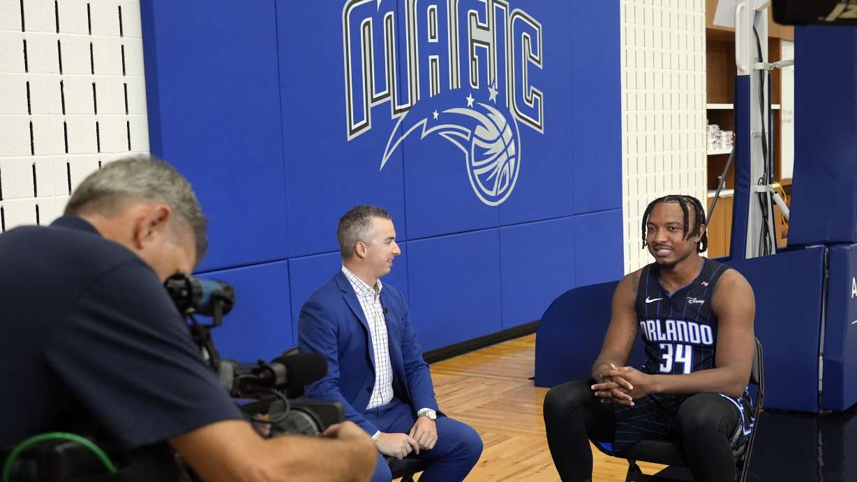 Orlando Magic center Wendell Carter Jr., right, takes part in an interview during the NBA basketball team's media day, Monday, Sept. 30, 2024, in Orlando, Fla.