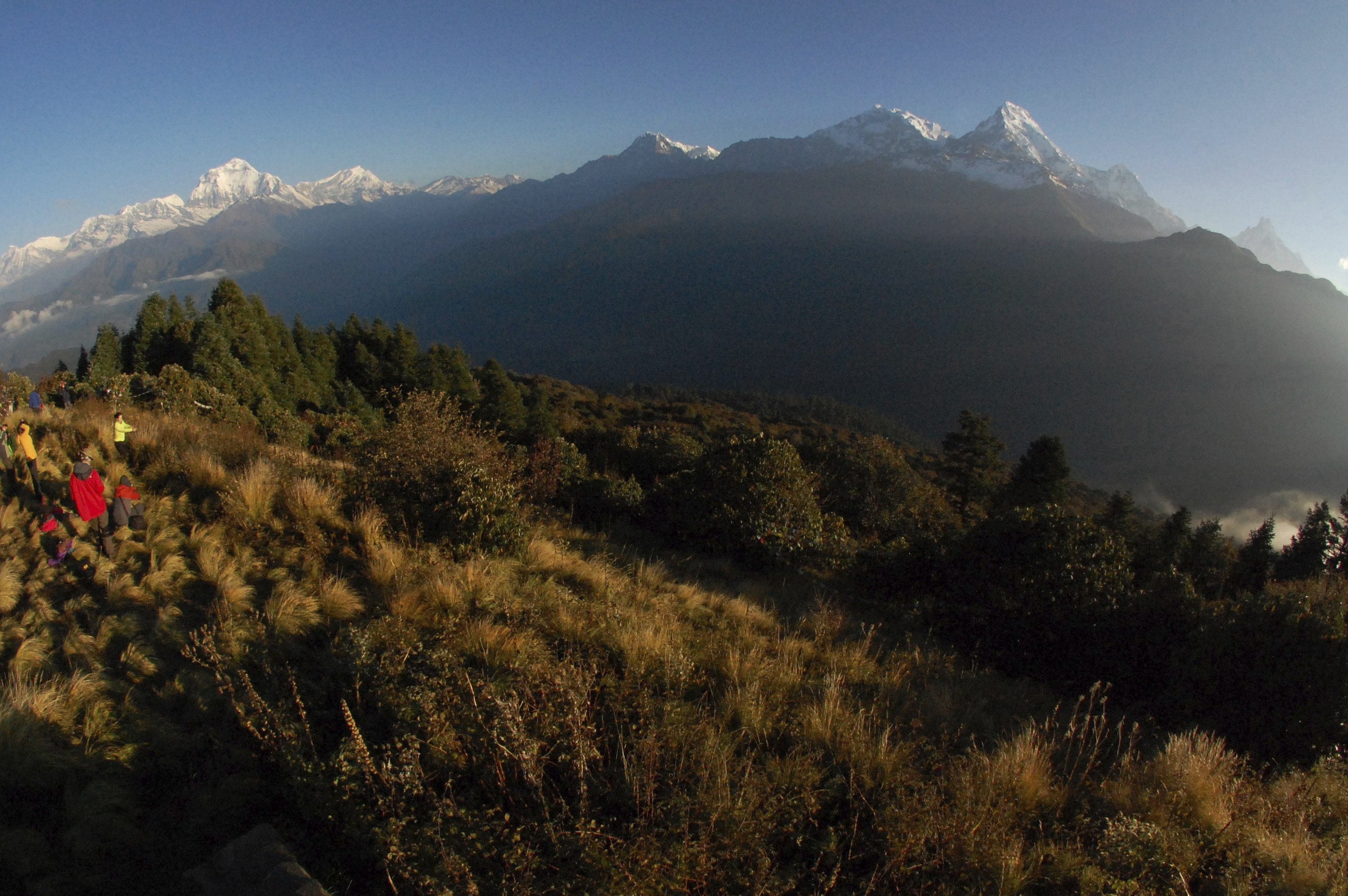 FILE -The Dhaulagiri Range, on the left and the Annapurna Range, on the right of the central Himalayas is seen as trekkers view the sweeping sunrise from Poon Hill, above the village of Ghorepani, in central Nepal, Oct. 24, 2014.