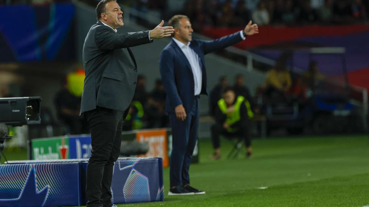 Young Boys' head coach Patrick Rahmen, left, reacts during the Champions League soccer match between Barcelona and Young Boys at the Lluis Companys Olympic Stadium in Barcelona, Spain, Tuesday, Oct. 1, 2024.