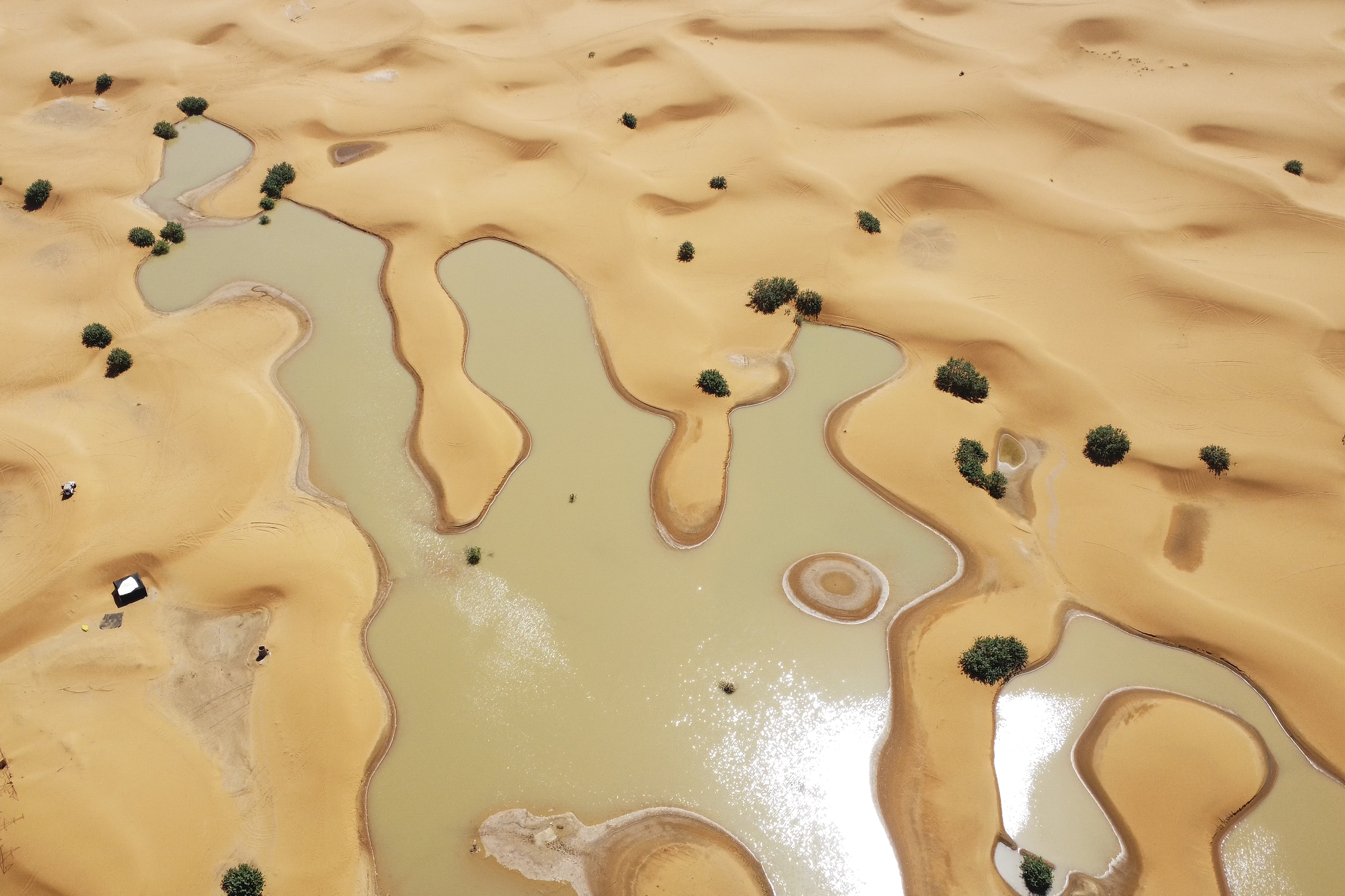 A view of lakes caused by heavy rainfall between sand dunes in the desert town of Merzouga, near Rachidia, southeastern Morocco, Oct. 2.
